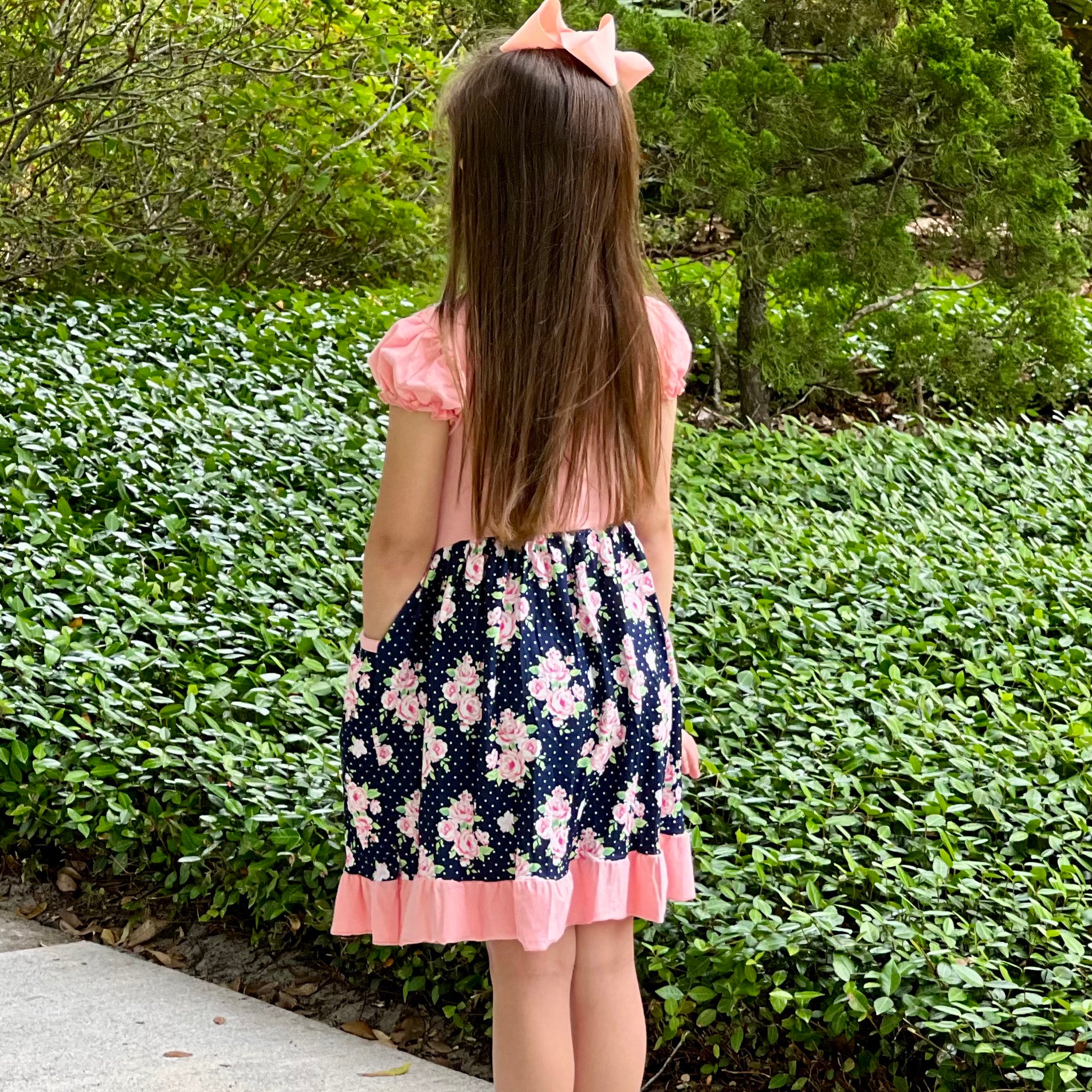 Girls Pink and Blue Floral Bouquet Dress with Ruffles and Pockets, perfect for parties.