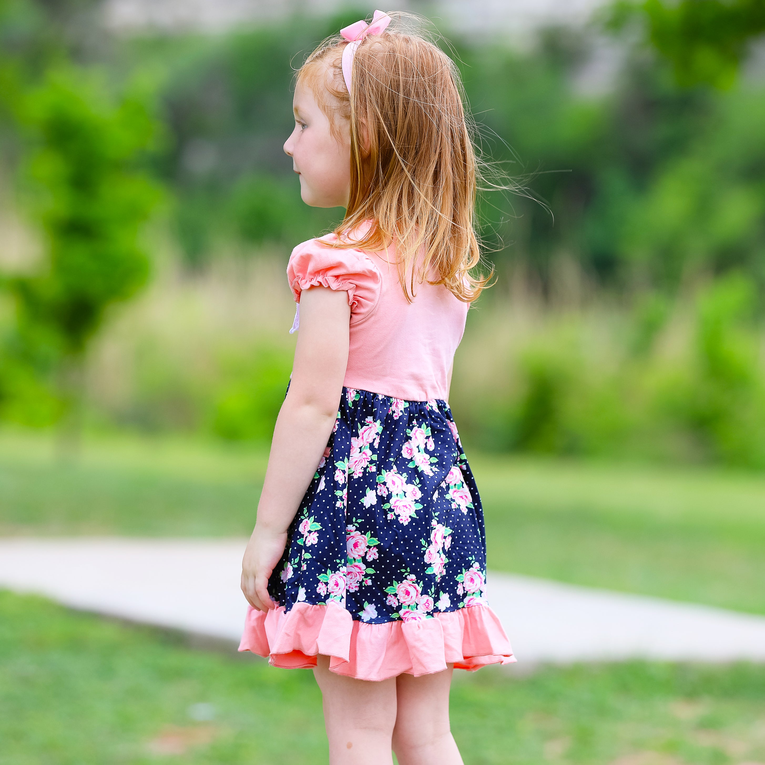 Girls Pink and Blue Floral Bouquet Dress with Ruffles and Pockets, perfect for parties.