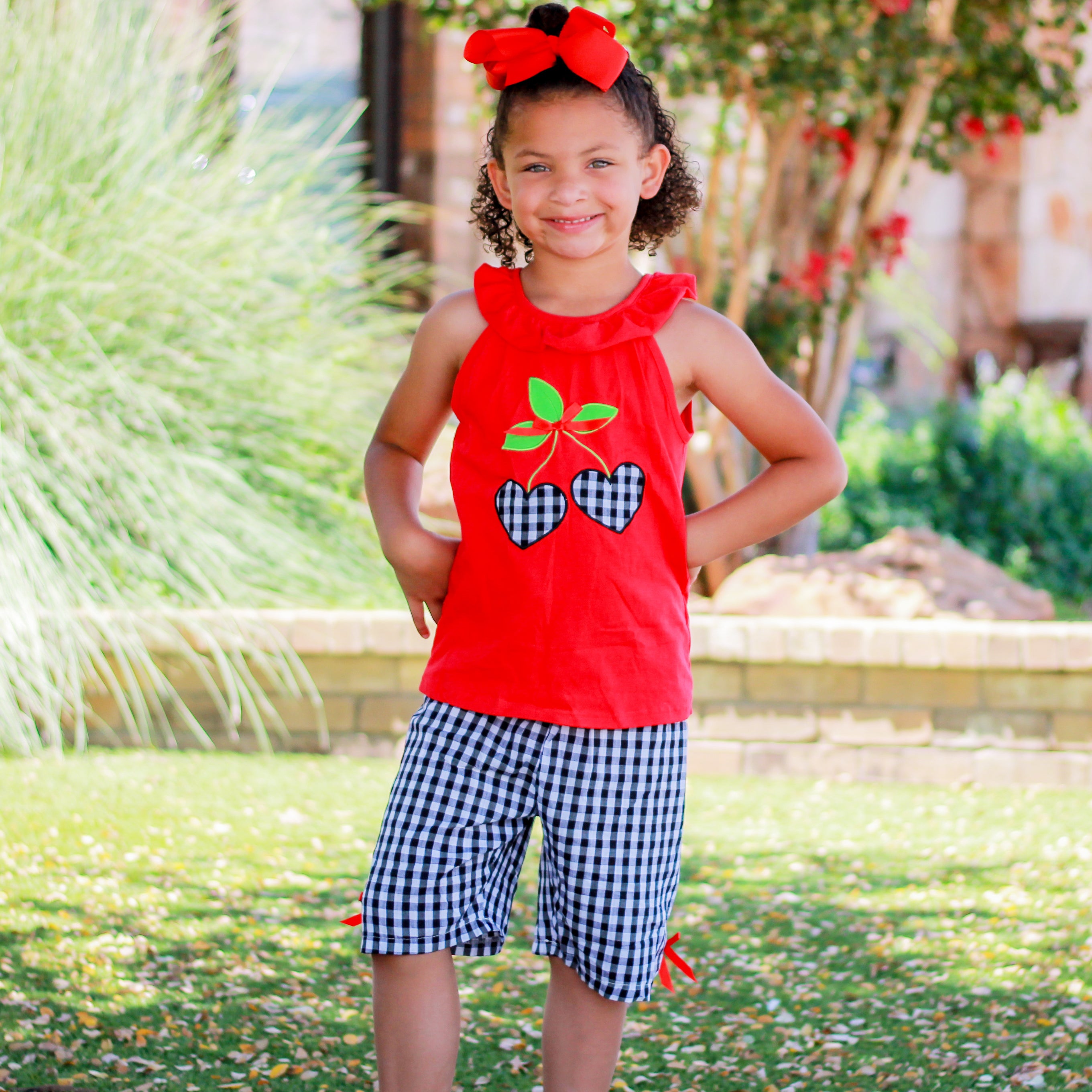 Girls Red Cherry Ruffled Tunic with Gingham Woven Shorts Outfit featuring angel cap sleeves and cherry heart applique.