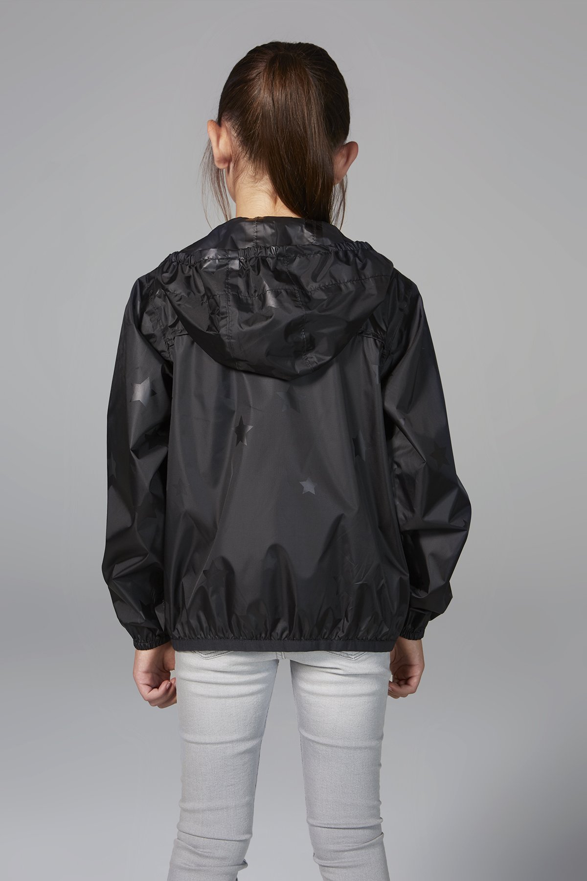 Kids black gloss stars packable rain jacket, showcasing its stylish design and practical features.