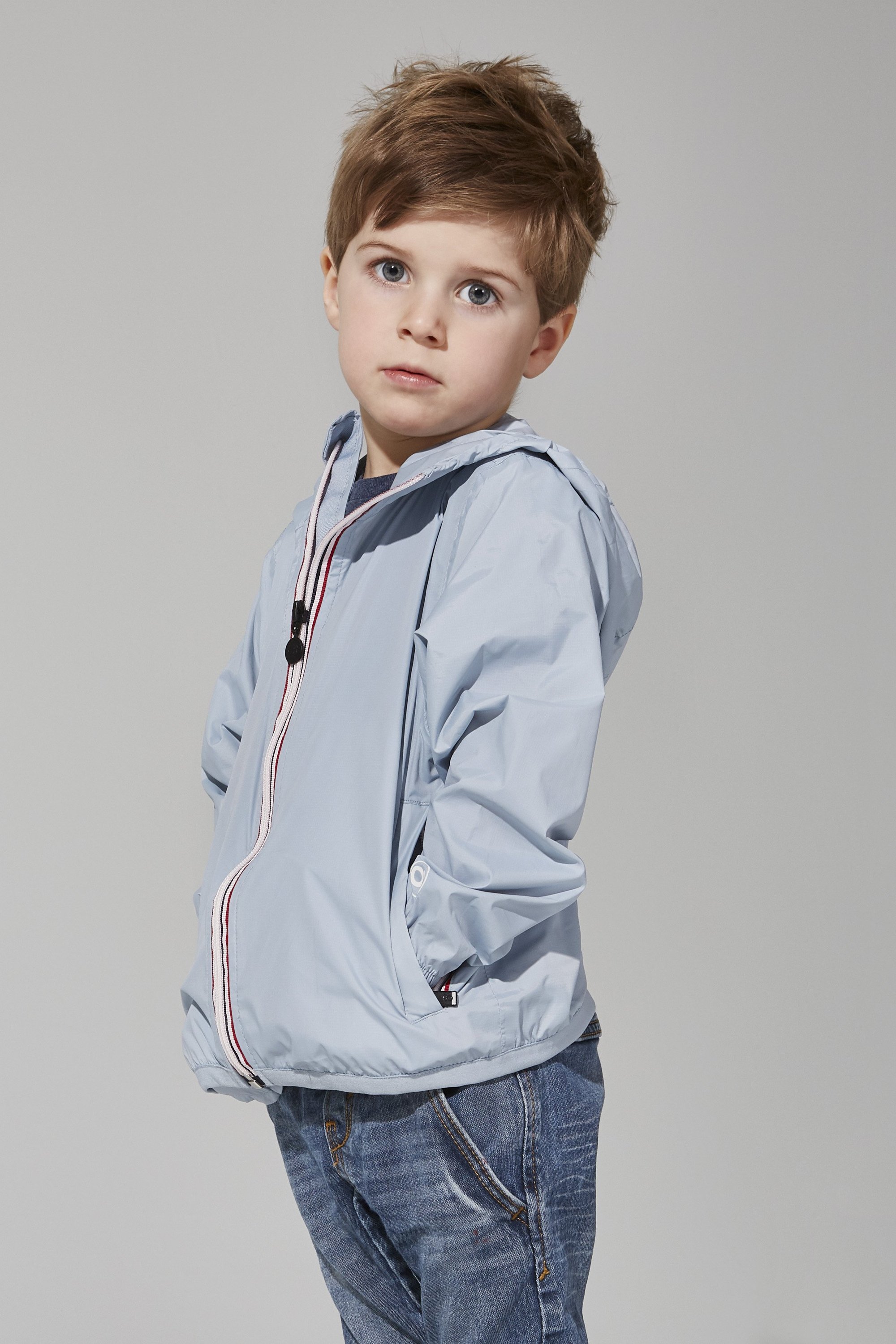 Kids Celestial Blue Full Zip Packable Rain Jacket, showcasing its vibrant color and packable design.