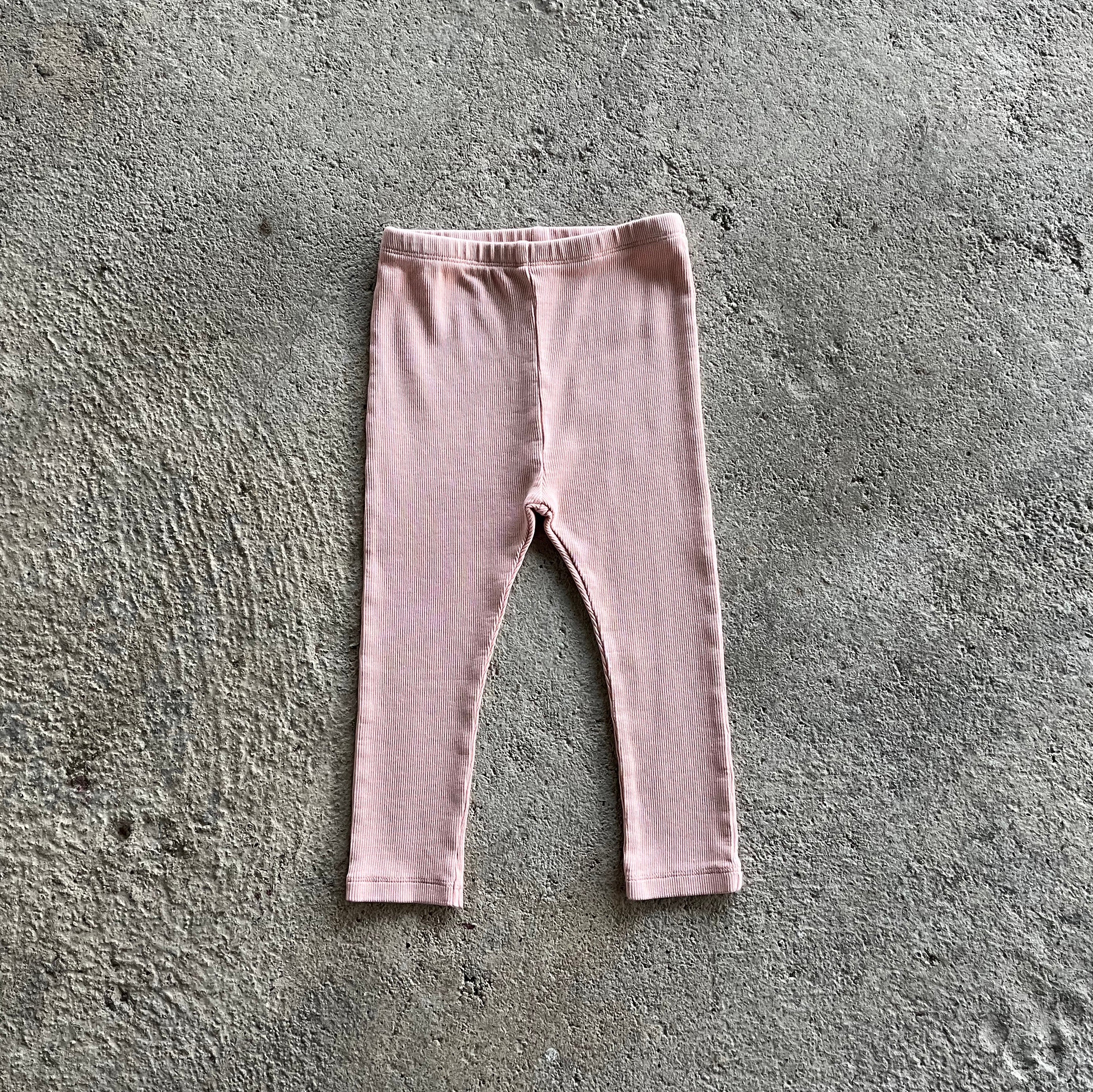 Oggy Pink Leggings for babies and toddlers, featuring a soft ribbed texture and elasticised waist, perfect for comfort and style.