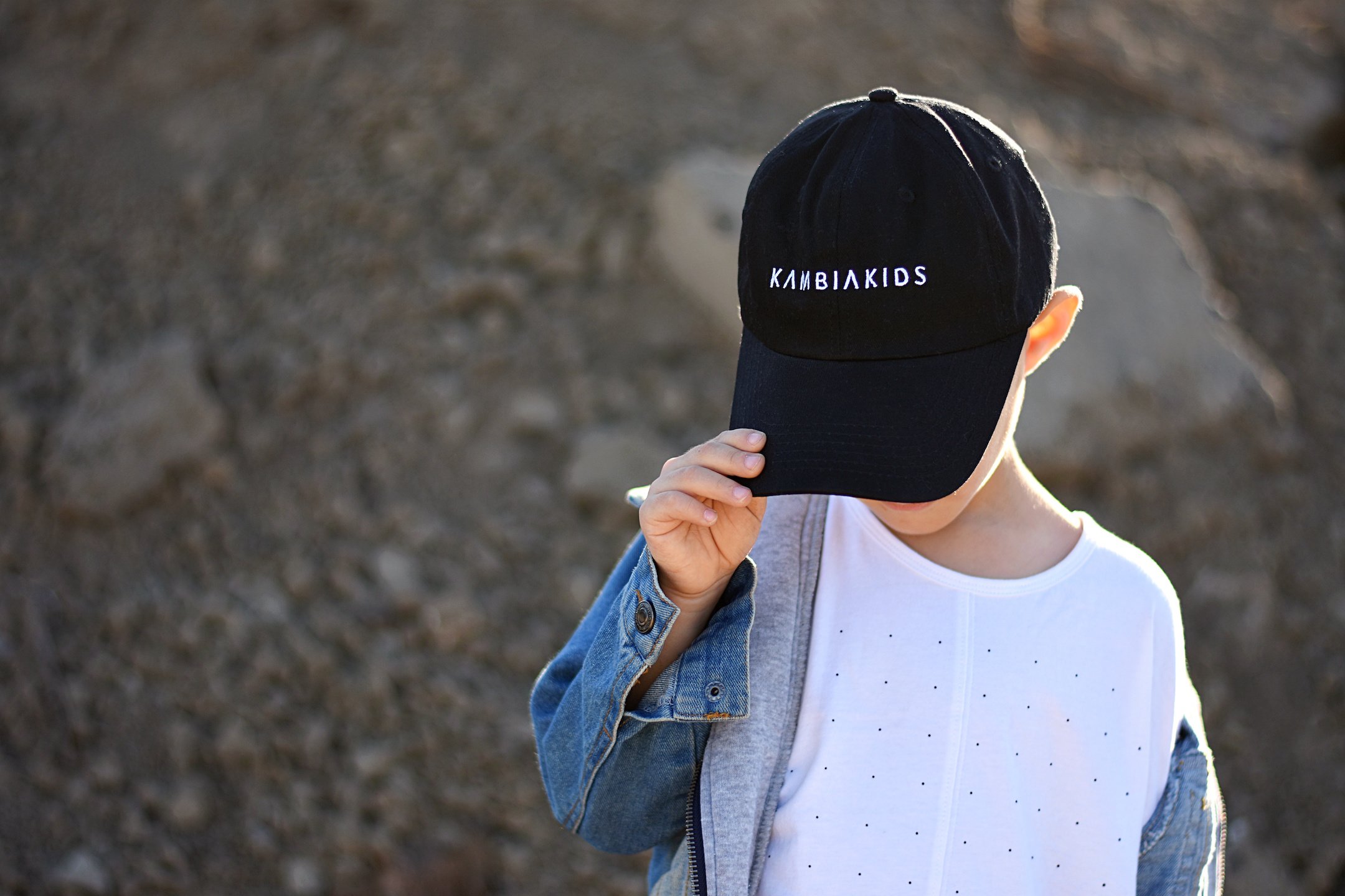 A stylish adjustable Logo Hat for kids, made from sustainable bamboo fabric, featuring a timeless design suitable for all genders.