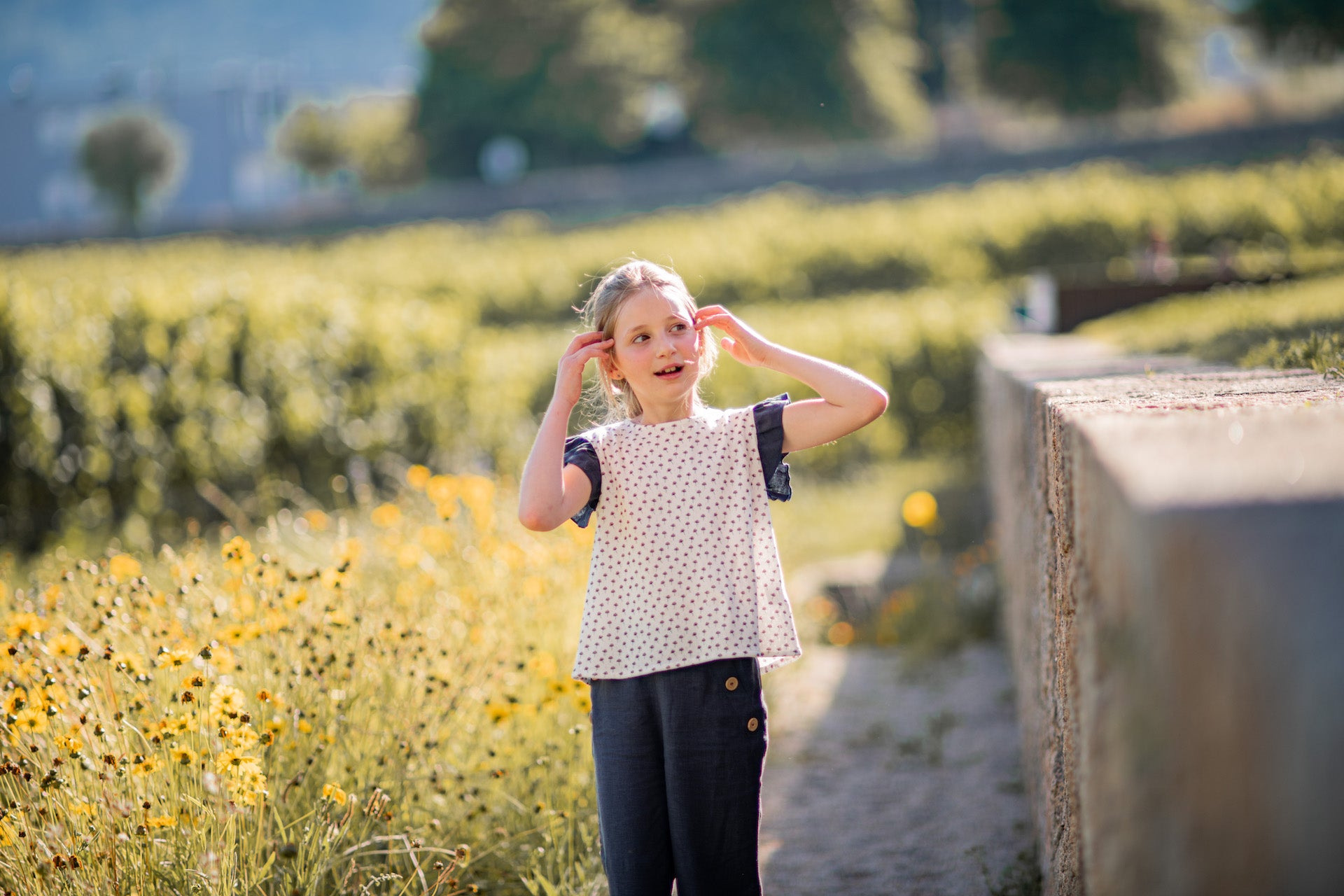 Child playing in a sunny field.