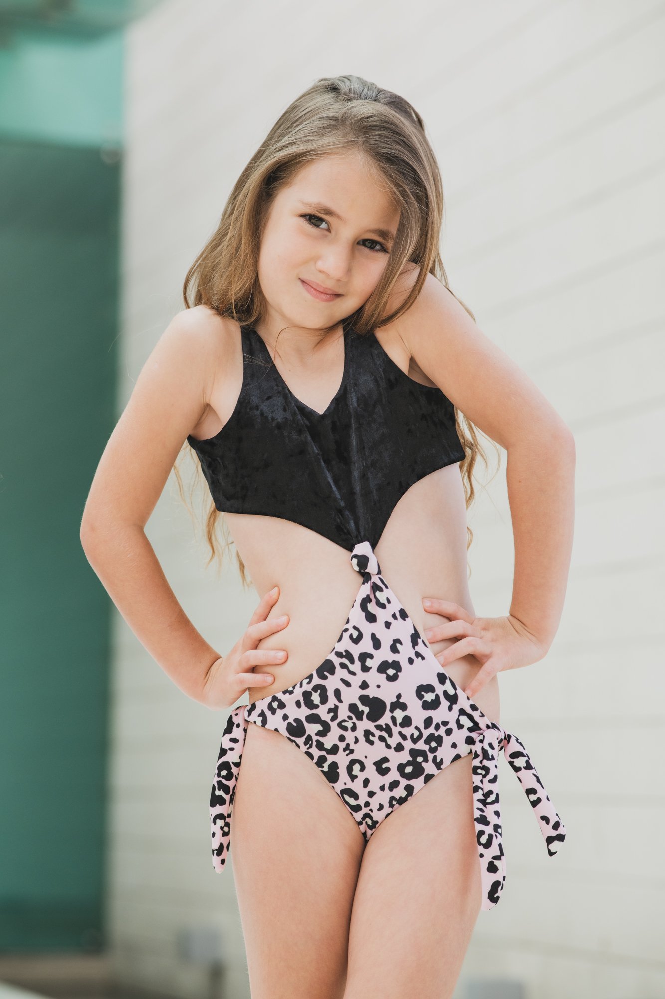 Kids swimwear featuring a pink leopard print trikini, designed for comfort and UV protection.