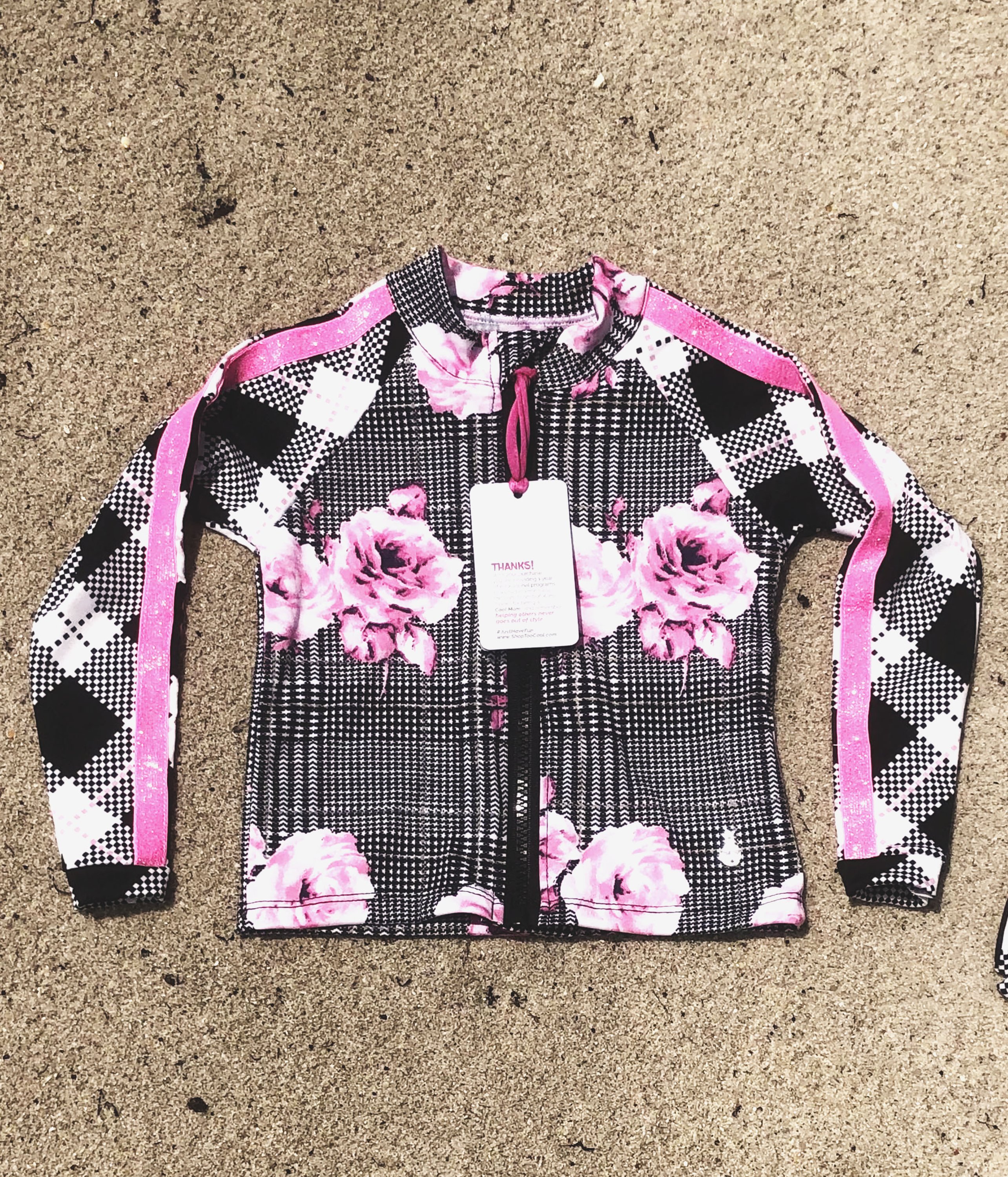 Pinky Rain Rash Guard Shirt featuring geometric and floral patterns, designed for girls with UV protection.