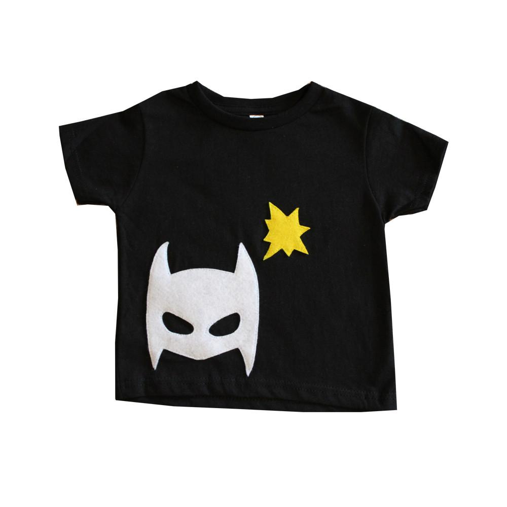 A vibrant Pow - Superhero Tee featuring colorful felt superhero appliqués, perfect for infants and toddlers, handmade with love.