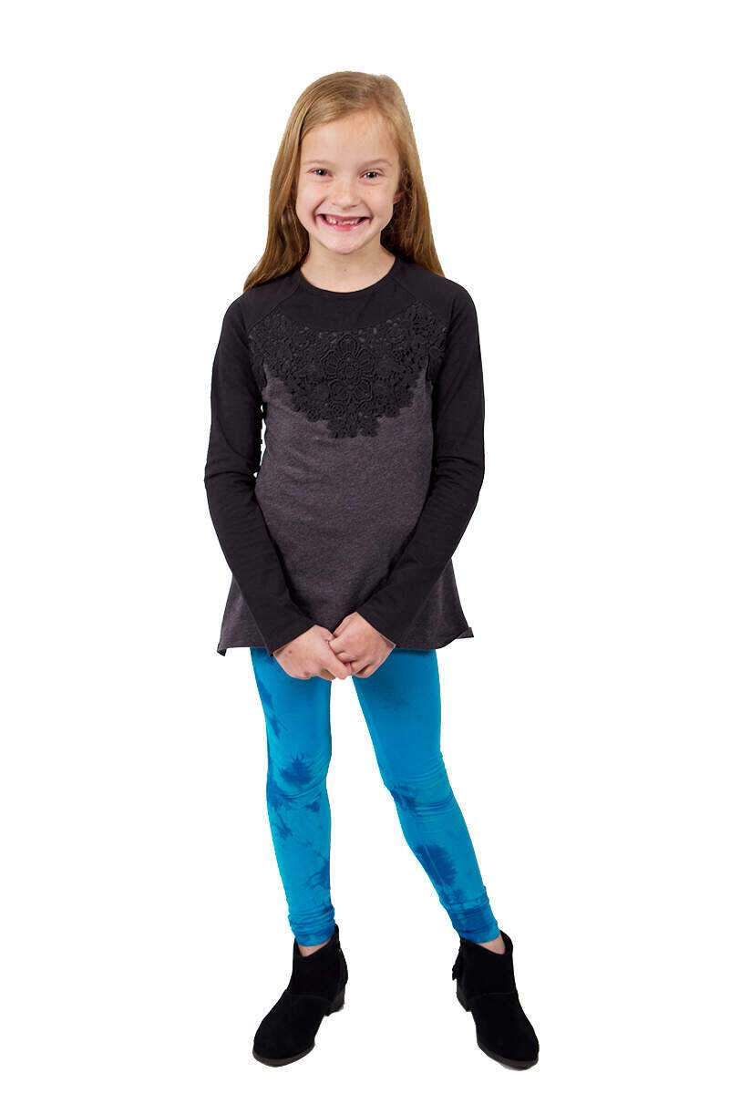 A stylish Ryanna Top with lace detailing paired with Blue Navy Tie Dye Leggings, showcasing a chic and comfortable outfit for girls.