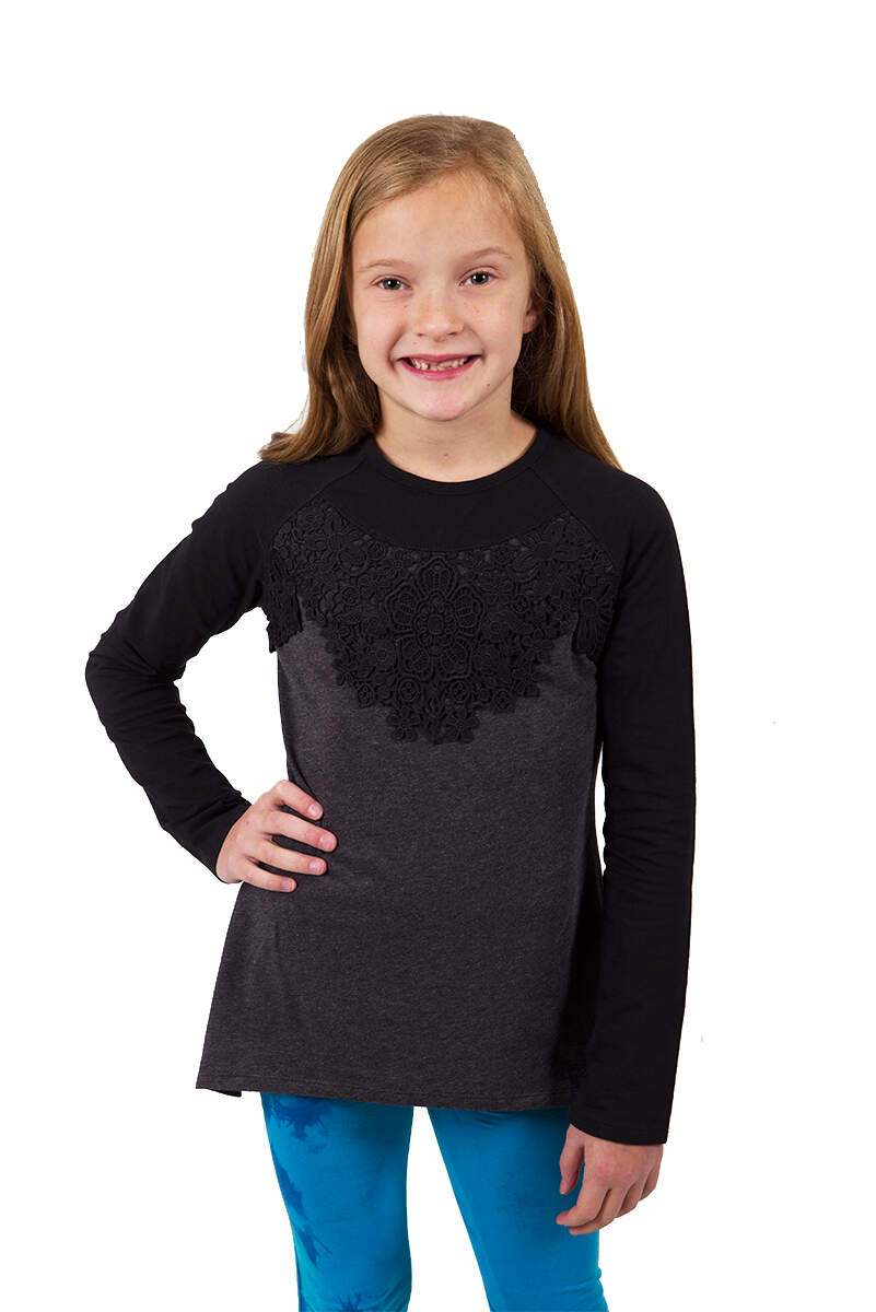 A stylish Ryanna Top with lace detailing paired with Blue Navy Tie Dye Leggings, showcasing a chic and comfortable outfit for girls.