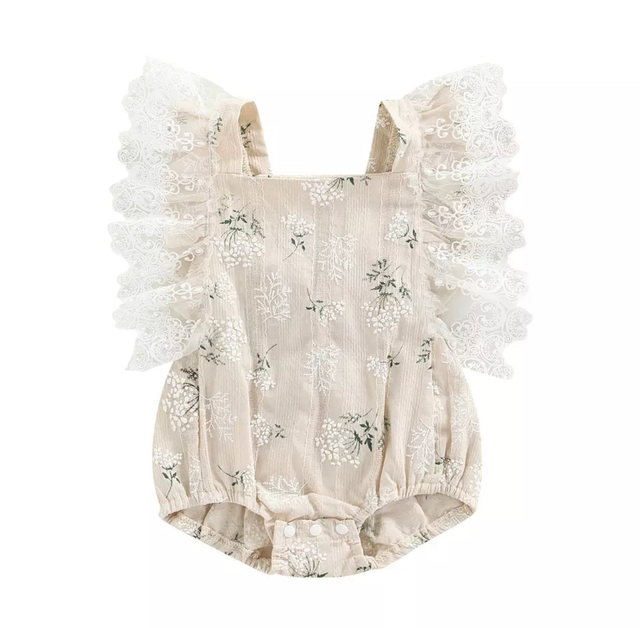 A stylish Scarlett Romper made of soft cotton, featuring a comfortable fit and versatile design suitable for various occasions.