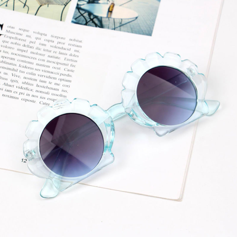 A pair of stylish seashell sunglasses with a unique design, perfect for summer beach outings.