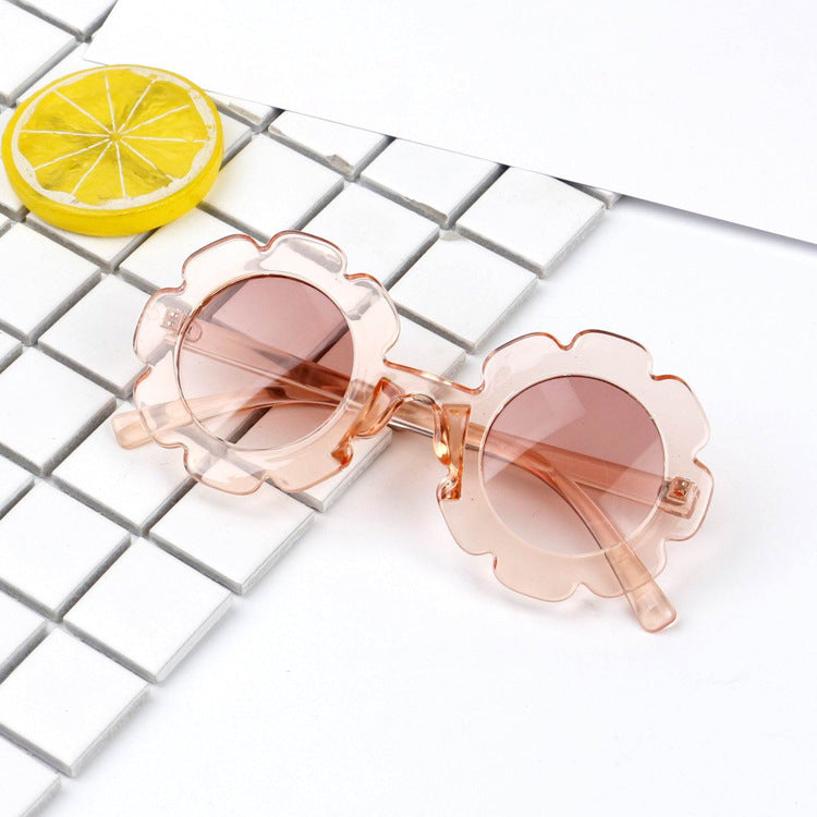 A pair of stylish seashell sunglasses with a unique design, perfect for summer beach outings.