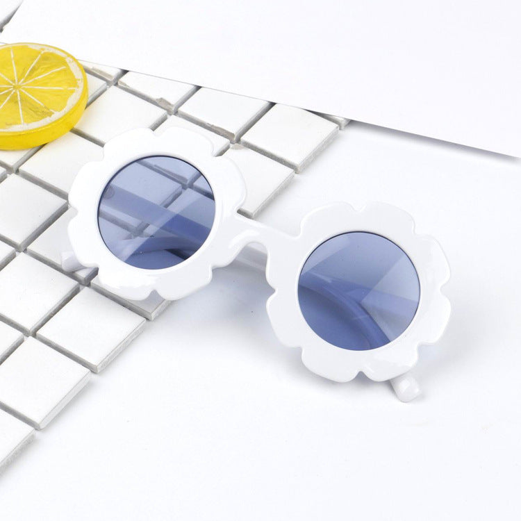 A pair of stylish seashell sunglasses with a unique design, perfect for summer beach outings.