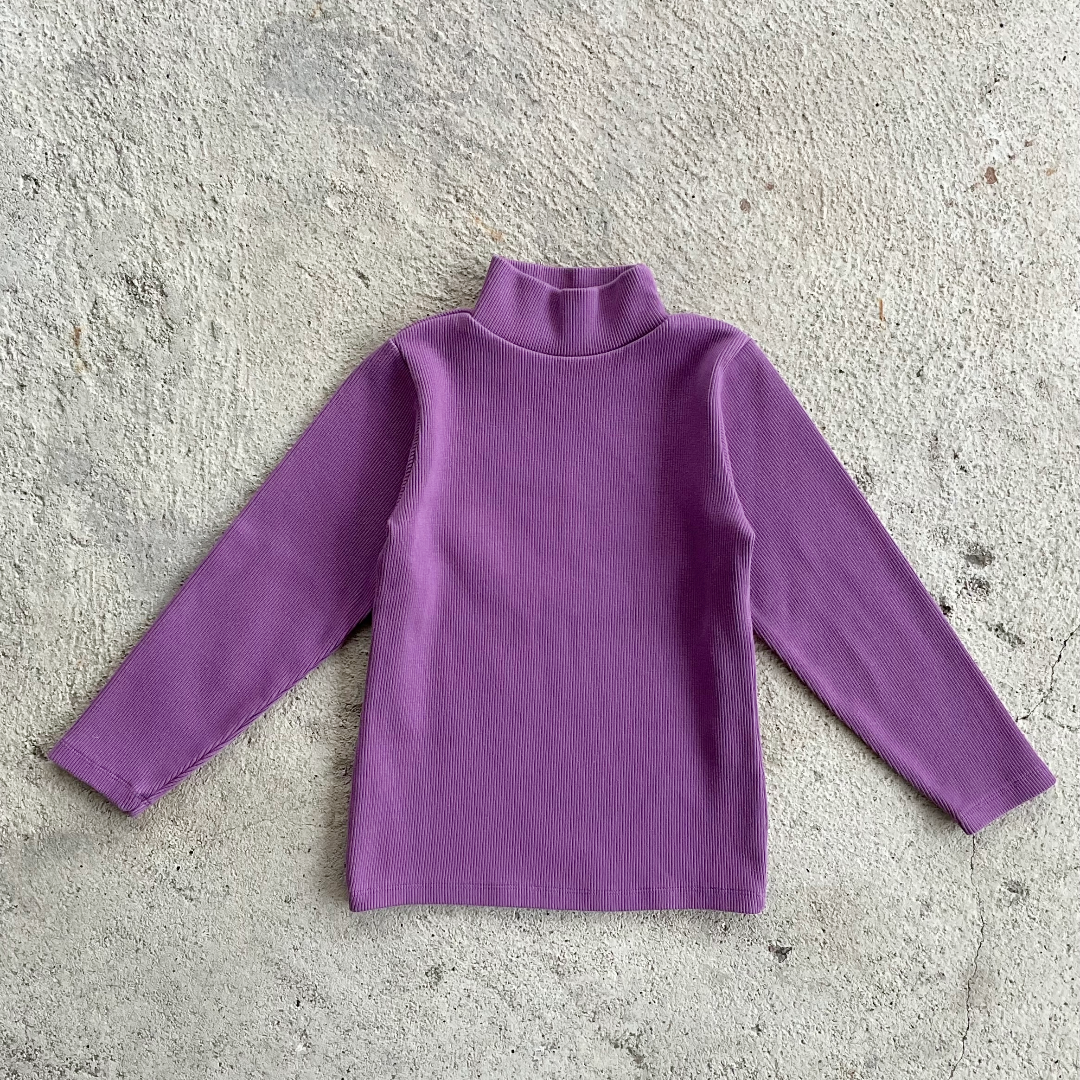 A vibrant orchid-colored ribbed long-sleeve shirt for kids with a turtle neck and round collar, made from 100% organic cotton.