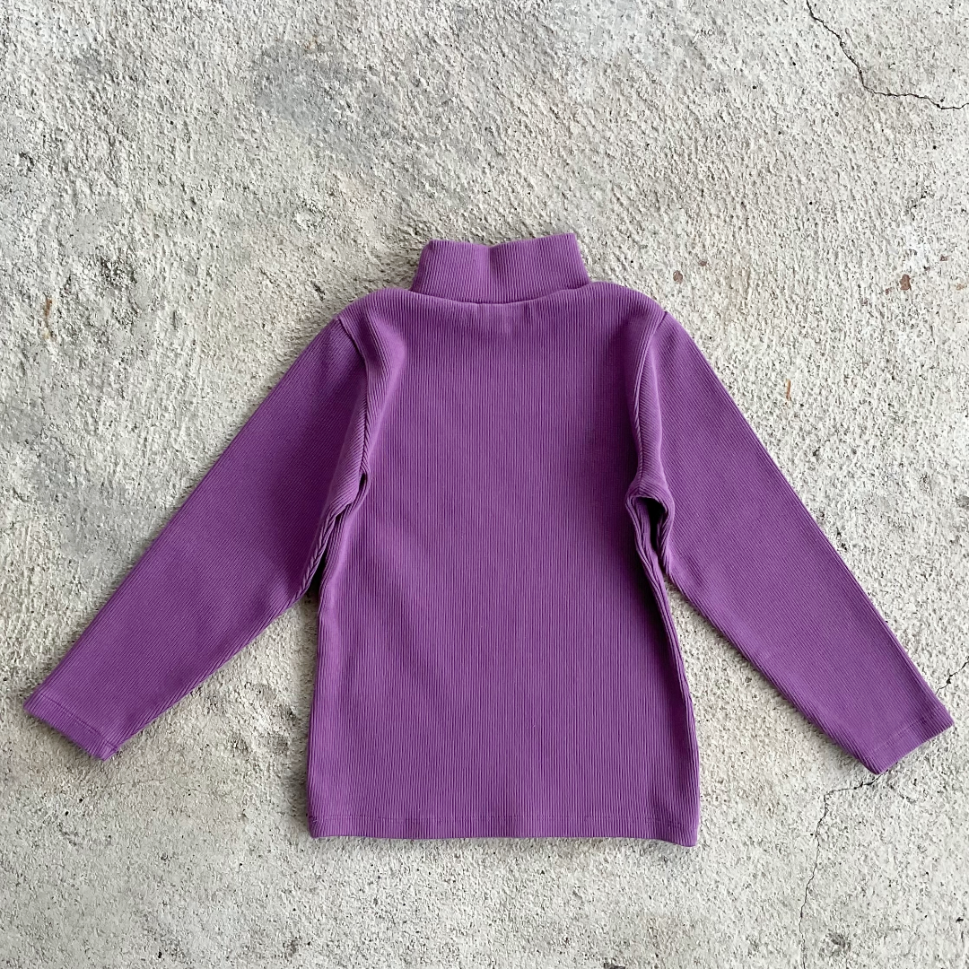 A vibrant orchid-colored ribbed long-sleeve shirt for kids with a turtle neck and round collar, made from 100% organic cotton.