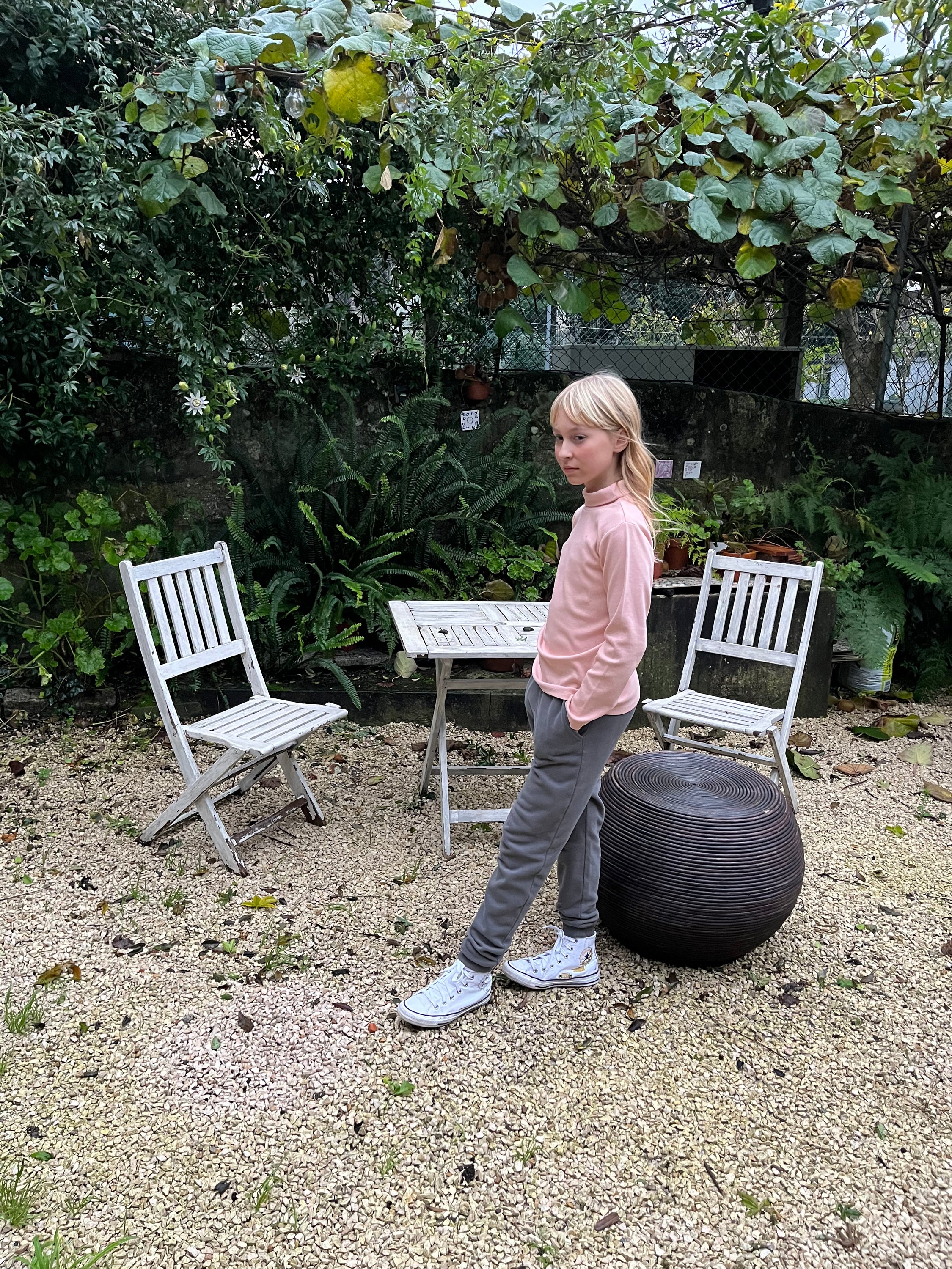 A pink ribbed long-sleeve shirt for kids with a turtle neck and round collar, made from 100% organic cotton.