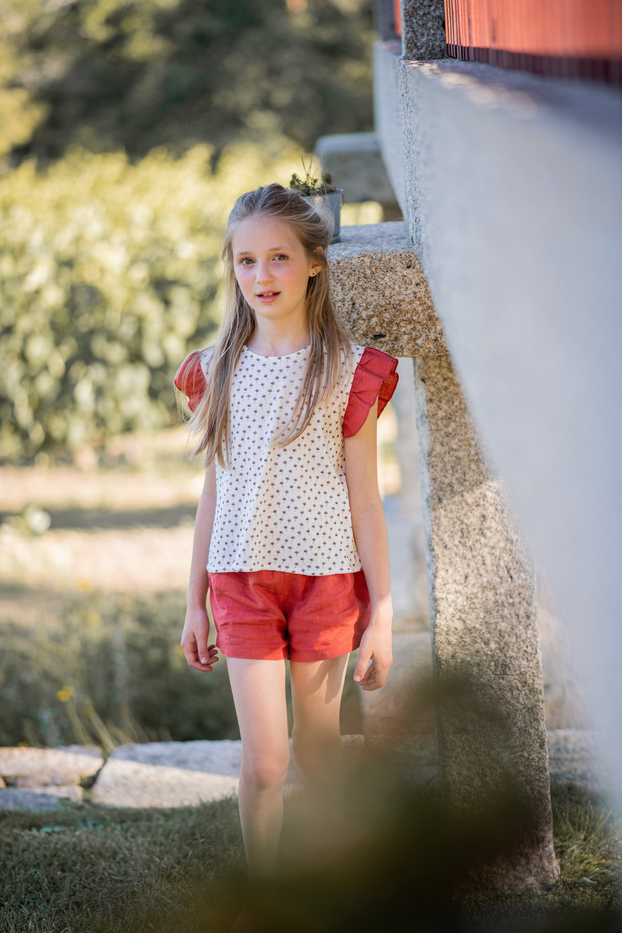 Crocus Terracotta Shorts made of 100% linen with frilled elasticised waist, showcasing a warm terracotta color.