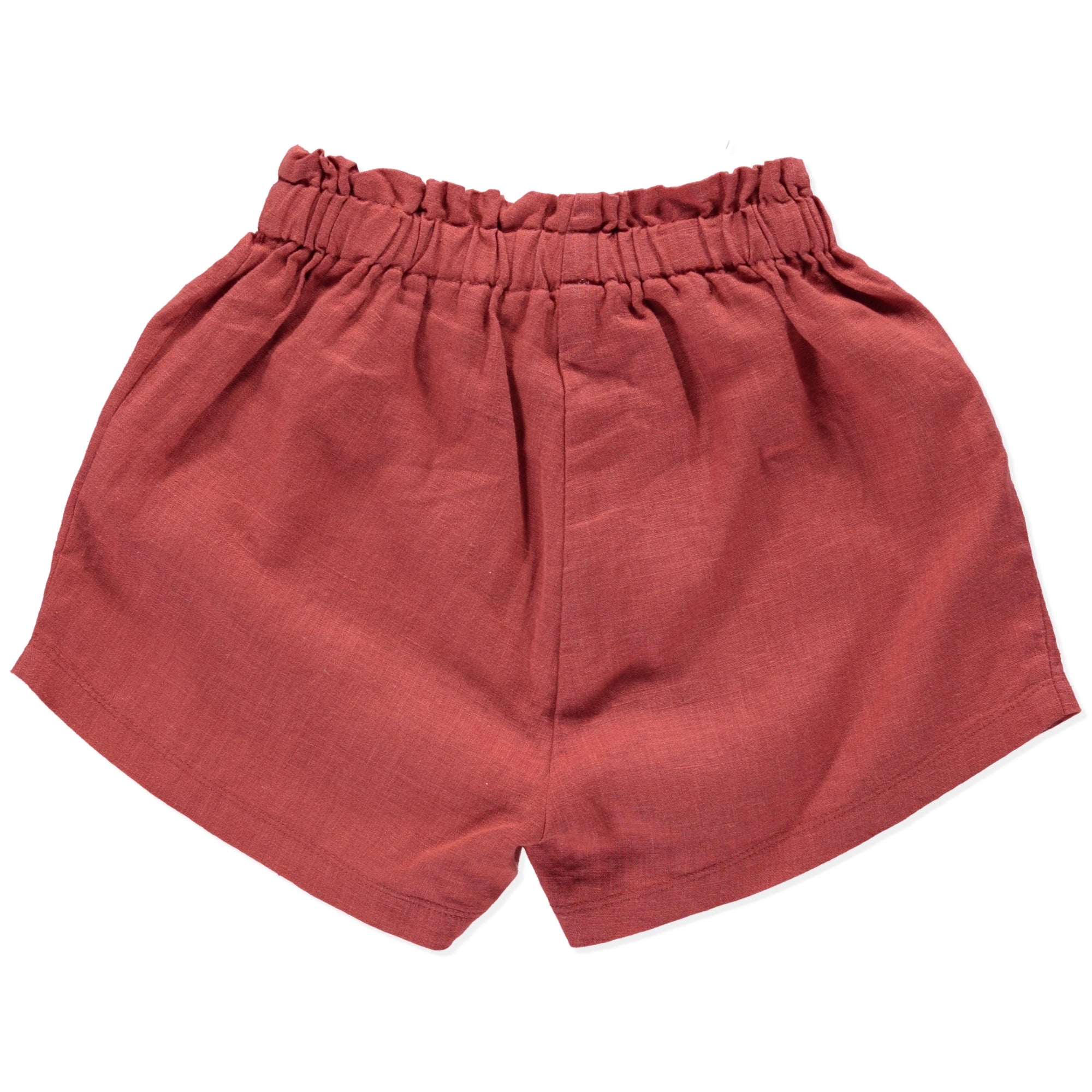 Crocus Terracotta Shorts made of 100% linen with frilled elasticised waist, showcasing a warm terracotta color.