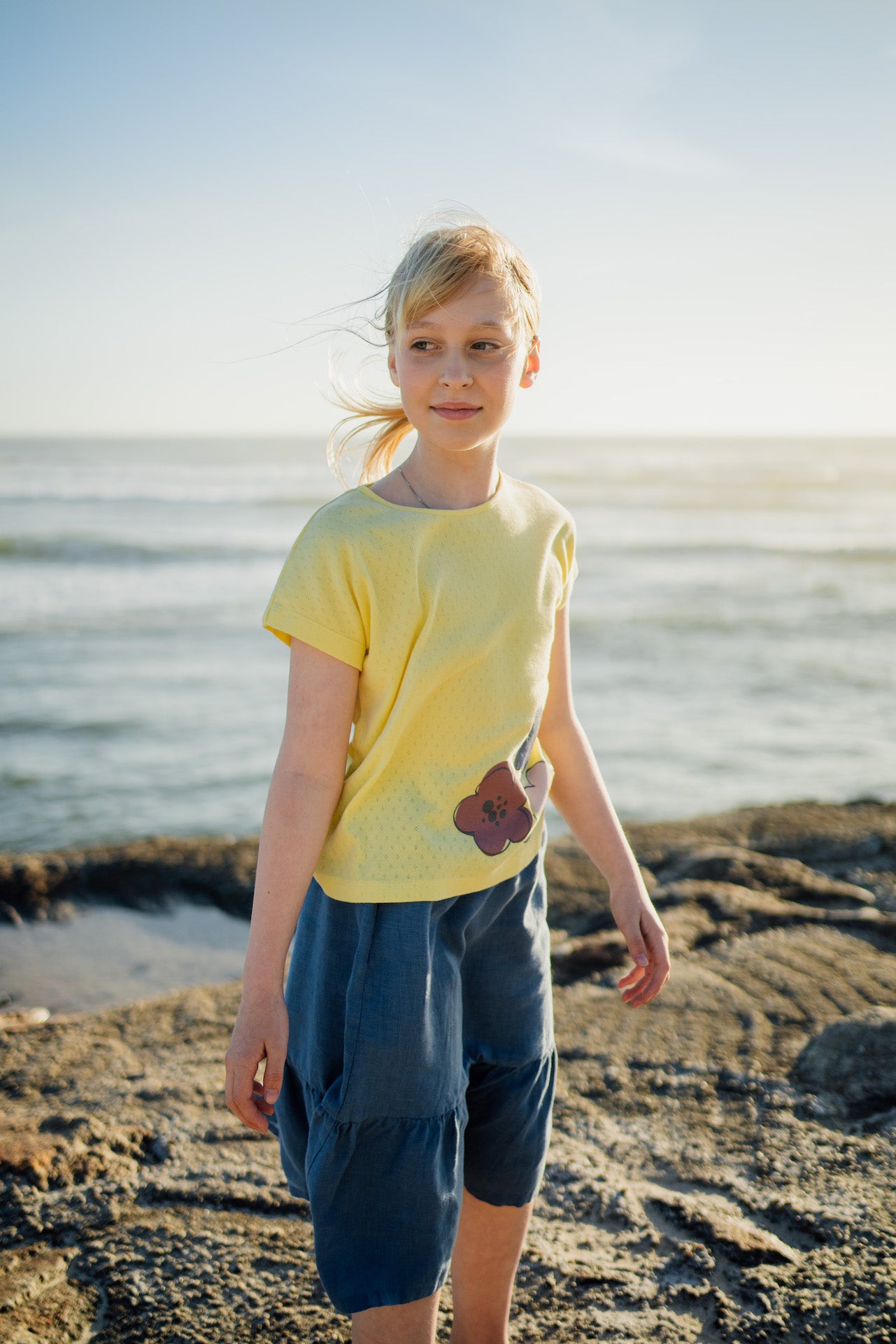 Skirt Tulip Celeste featuring a rose, blue celeste, and sienna cream color scheme, made from 100% linen with an elasticised waist and side pockets.