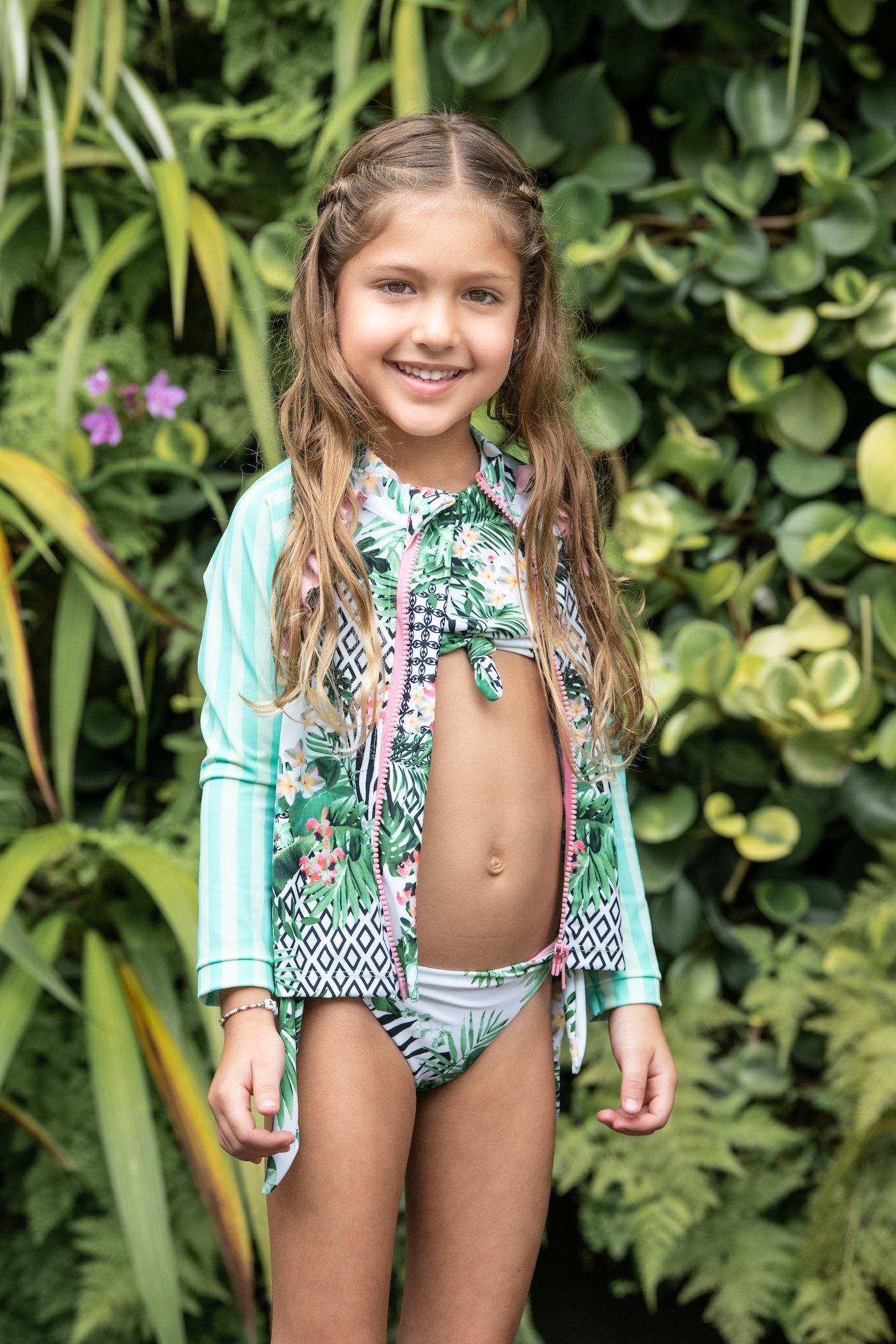 Kids Striped Forest Rash Guard featuring long sleeves and a zip front, designed for UV protection and comfort during swim activities.