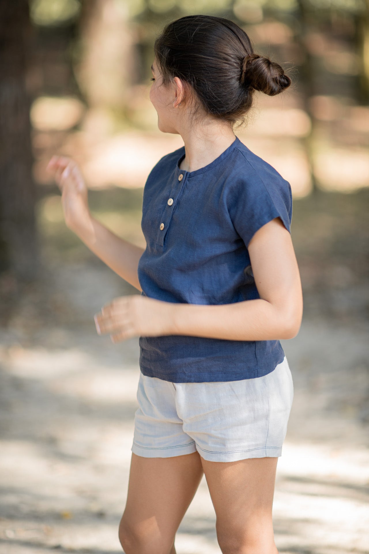 Top Marigold Blue, a casual boxy linen top with olive wood buttons, in vibrant blue color.