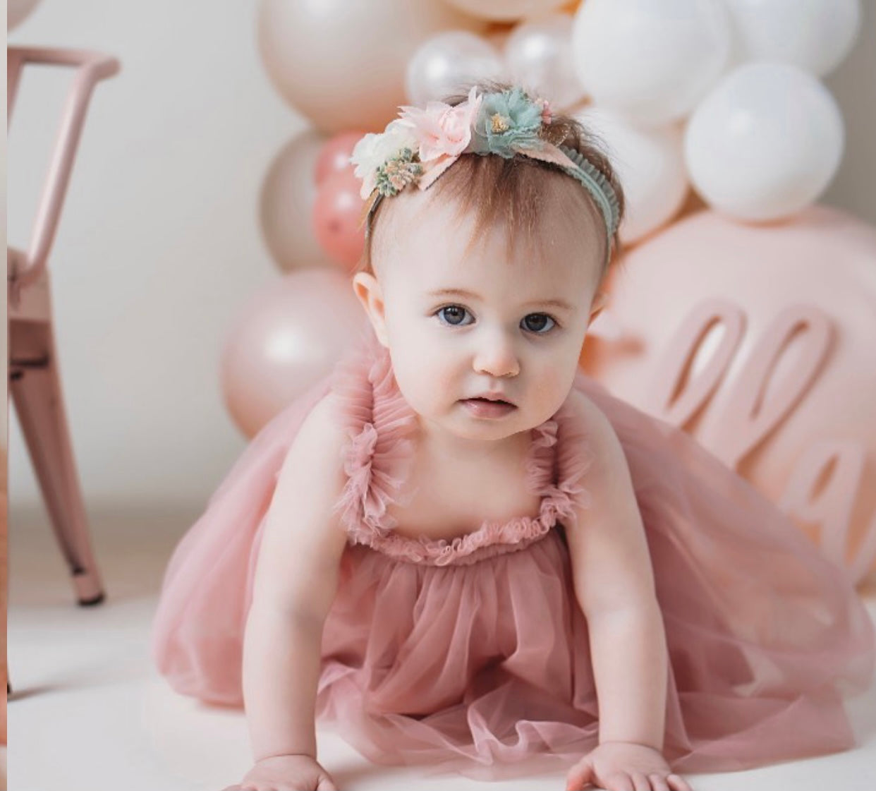 A beautiful mauve tulle A-line dress featuring a cotton under layer and tulle top layer, perfect for little girls' parties.