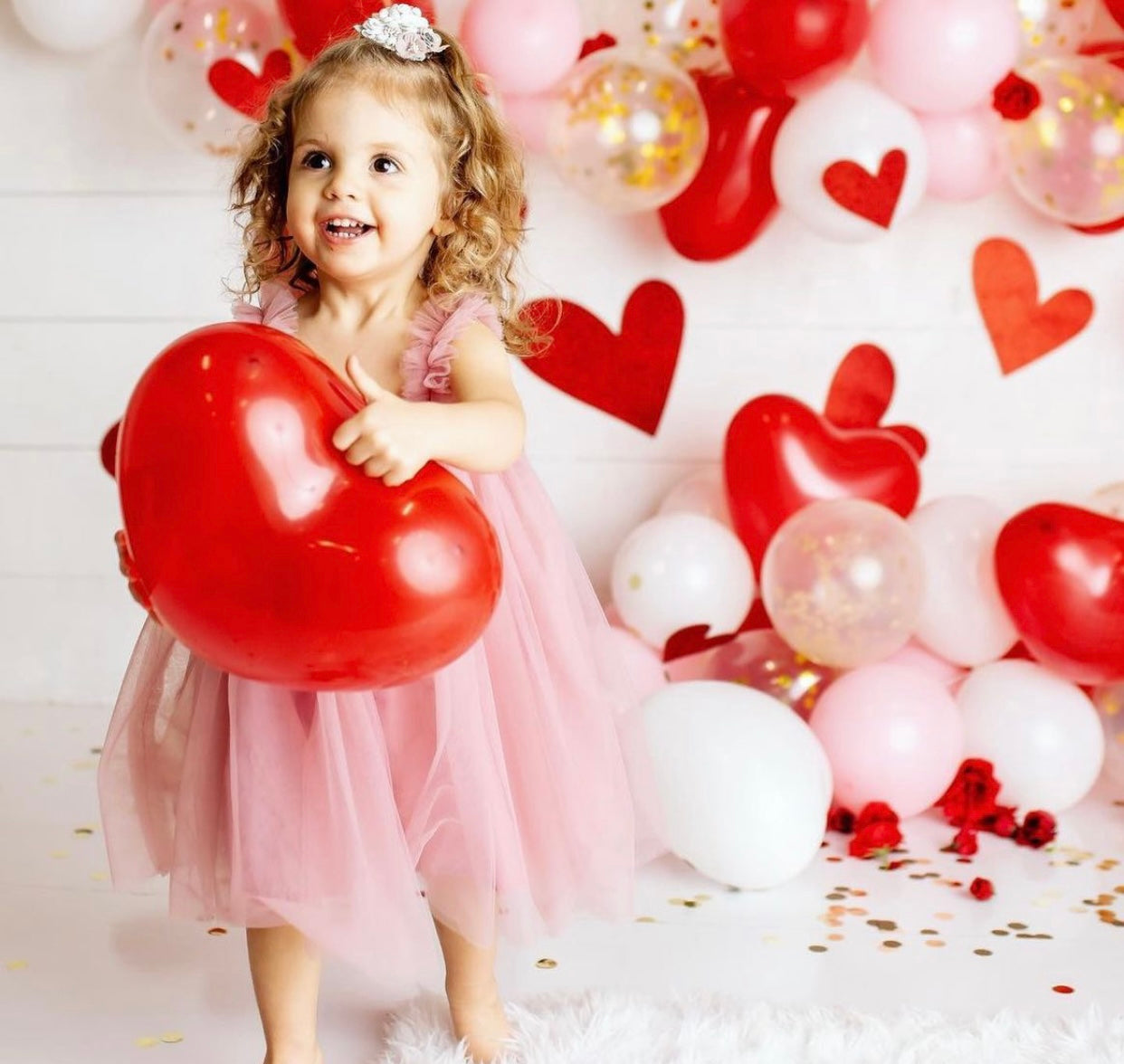 A beautiful mauve tulle A-line dress featuring a cotton under layer and tulle top layer, perfect for little girls' parties.