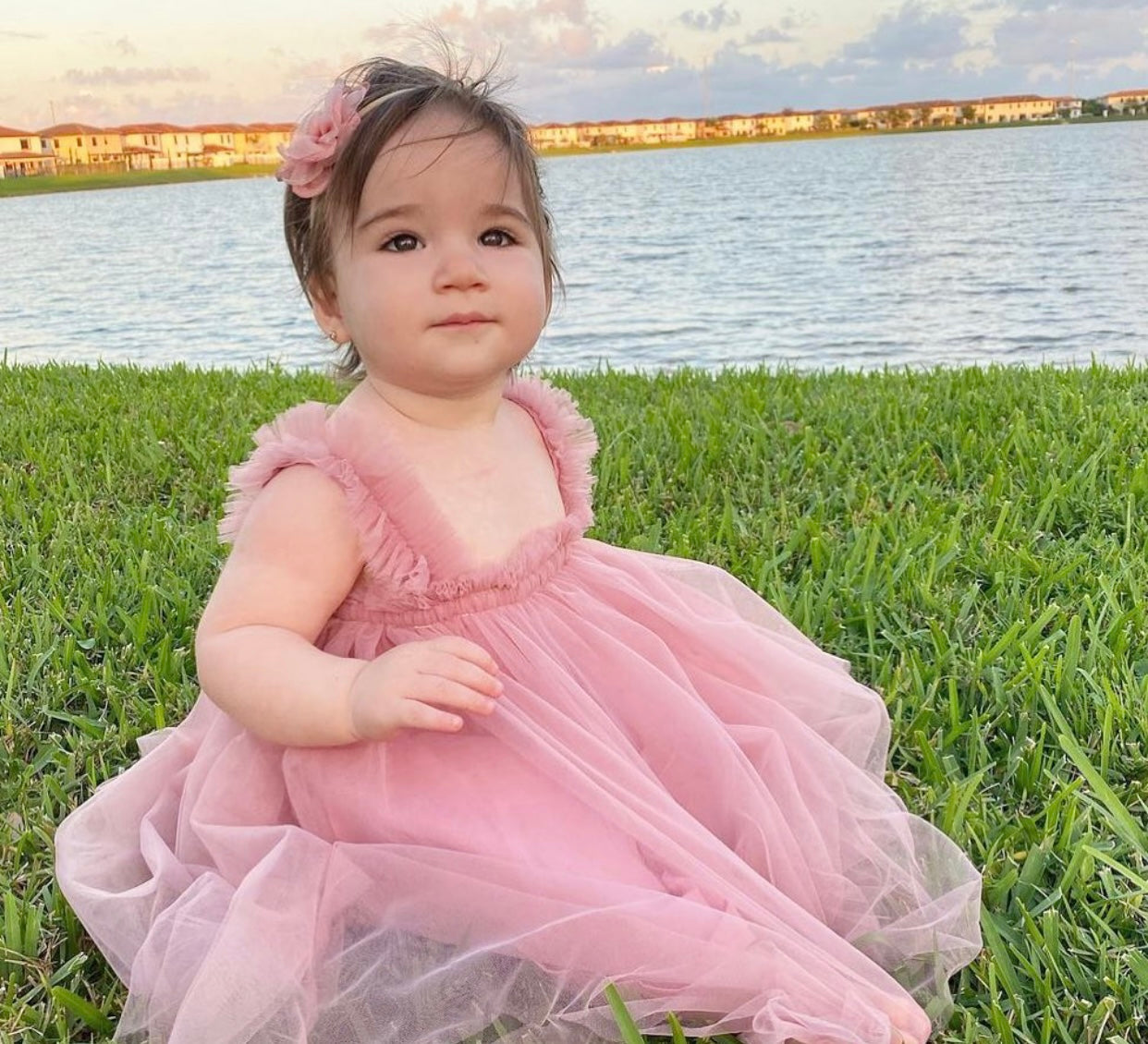 A beautiful mauve tulle A-line dress featuring a cotton under layer and tulle top layer, perfect for little girls' parties.