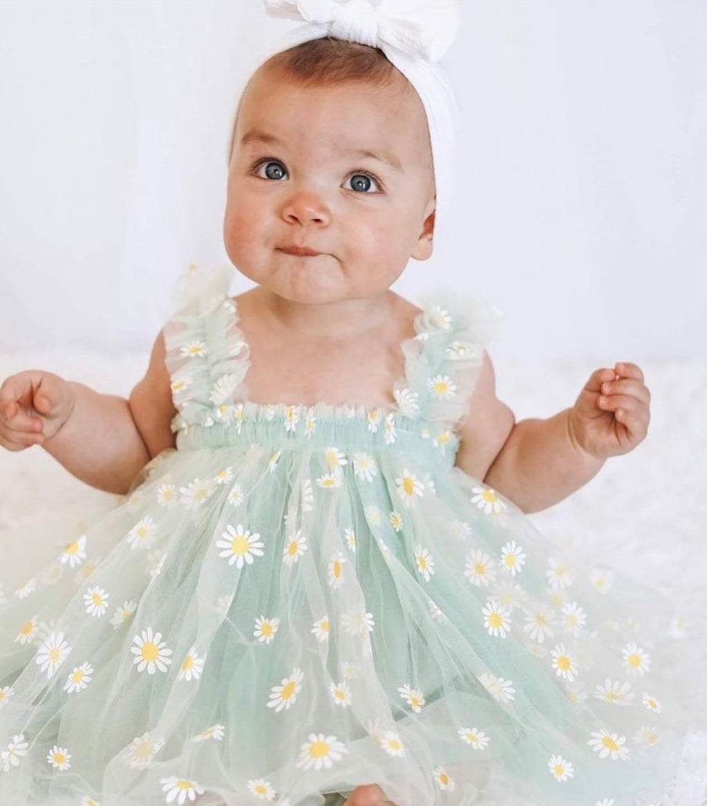 Mint tulle daisy dress featuring a cotton under layer and tulle top layer with daisy prints, designed for summer parties.