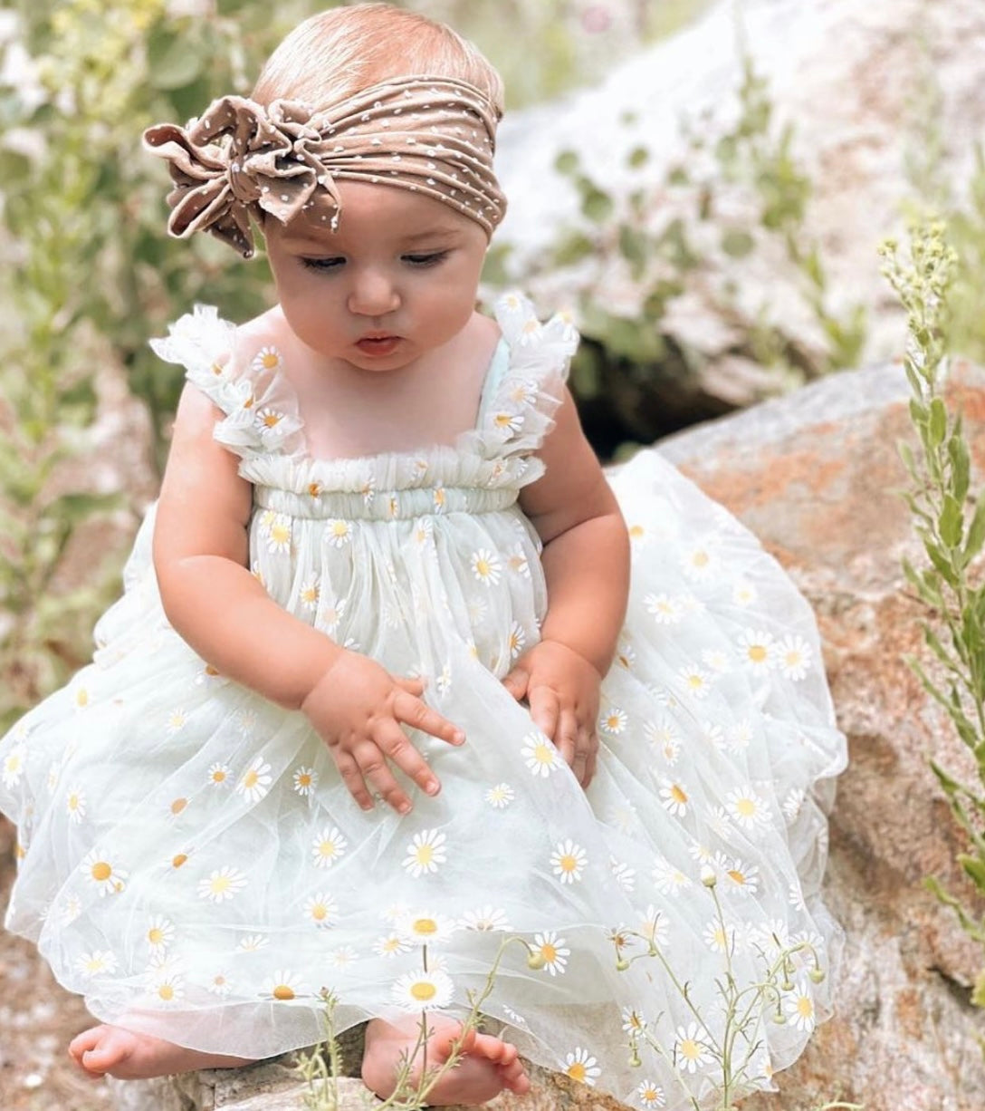 Mint tulle daisy dress featuring a cotton under layer and tulle top layer with daisy prints, designed for summer parties.