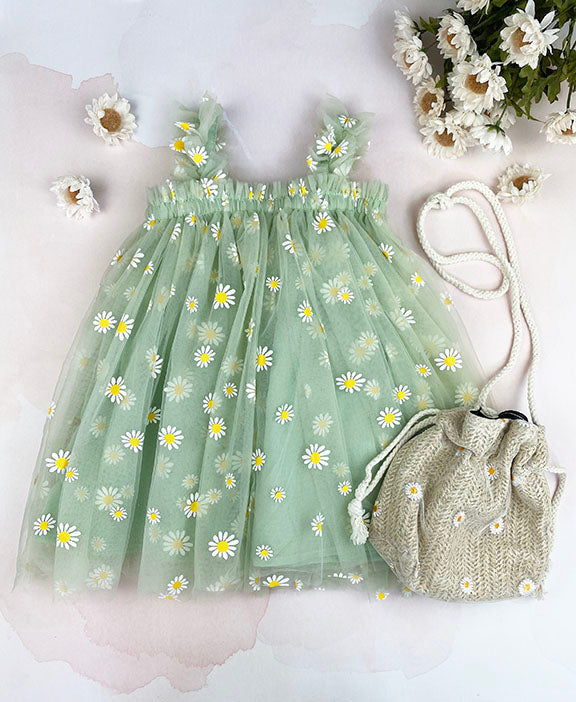 Mint tulle daisy dress featuring a cotton under layer and tulle top layer with daisy prints, designed for summer parties.