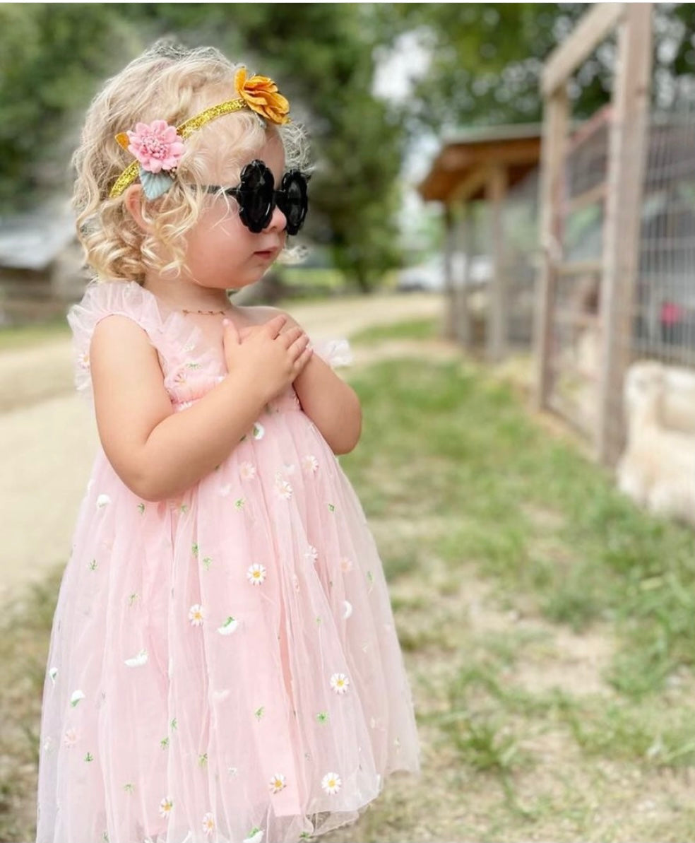 A beautiful yellow and pink tulle spring floral dress with embroidered flowers, perfect for summer parties.