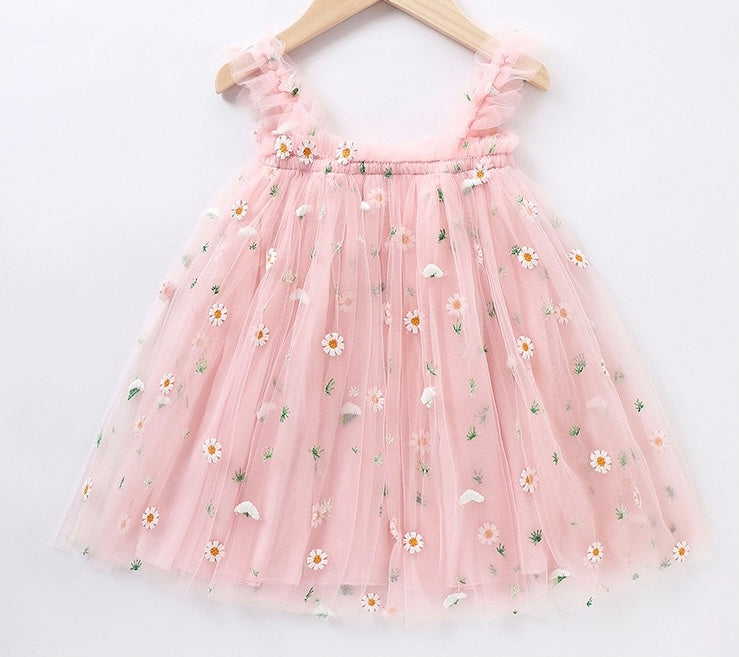 A beautiful yellow and pink tulle spring floral dress with embroidered flowers, perfect for summer parties.