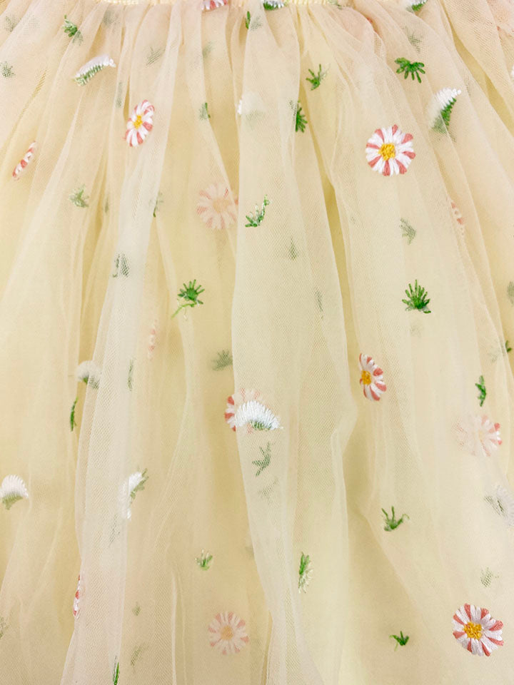 A beautiful yellow and pink tulle spring floral dress with embroidered flowers, perfect for summer parties.