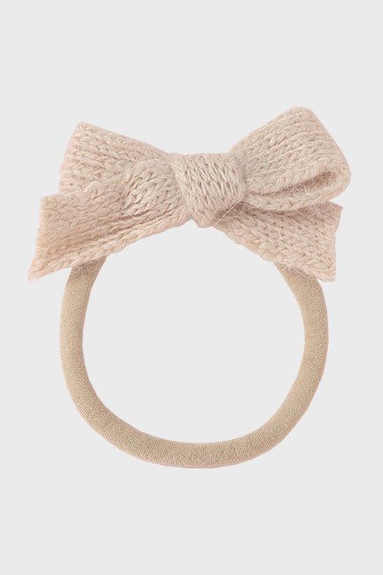 A cozy wool bow headband for babies, featuring a soft nylon band and a stylish 3-inch bow, available in multiple colors.