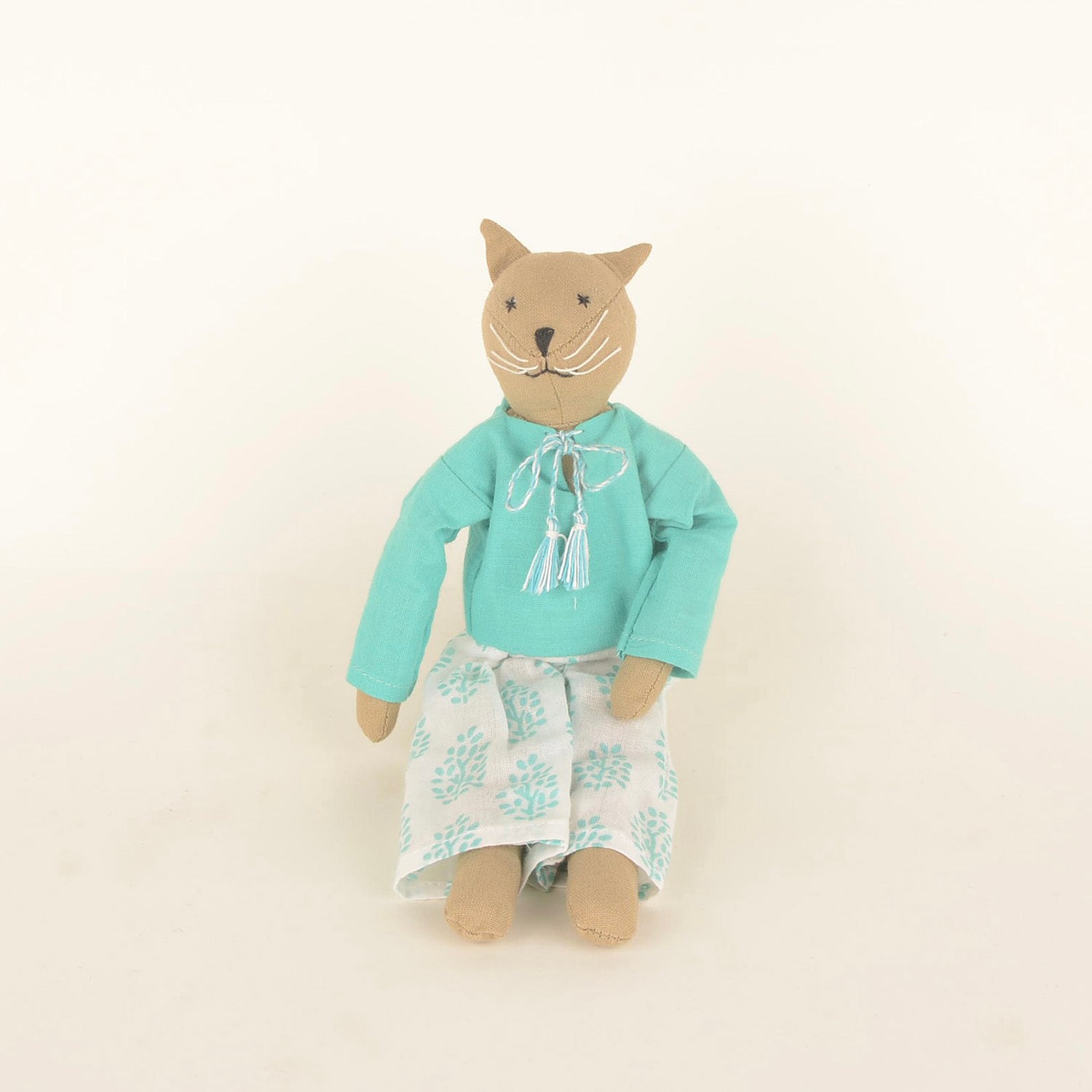 Caramel Mini — The Cat, a handcrafted doll made from sustainable materials, featuring cotton body, woollen hair, and cozy bedding in a foldable box.