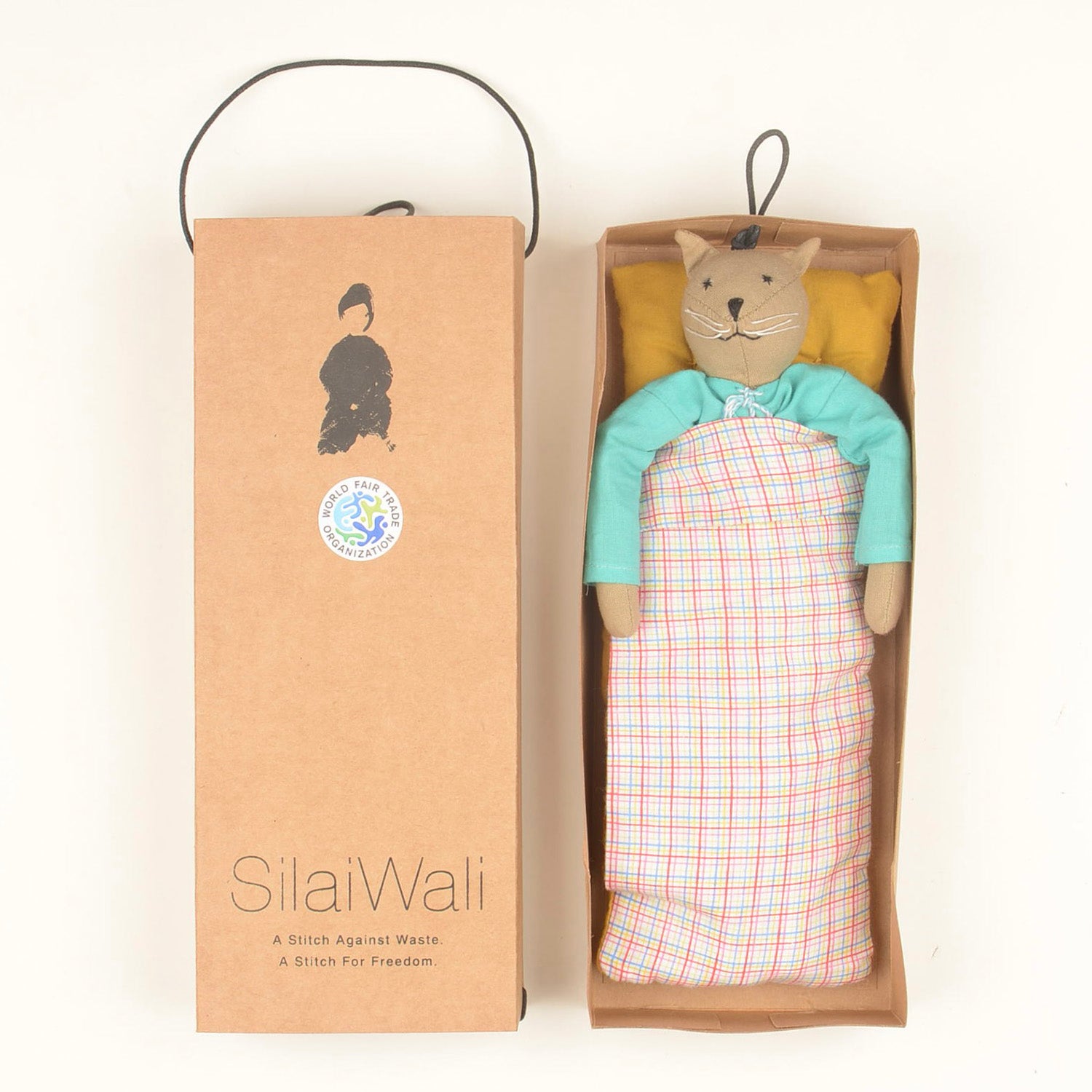 Caramel Mini — The Cat, a handcrafted doll made from sustainable materials, featuring cotton body, woollen hair, and cozy bedding in a foldable box.