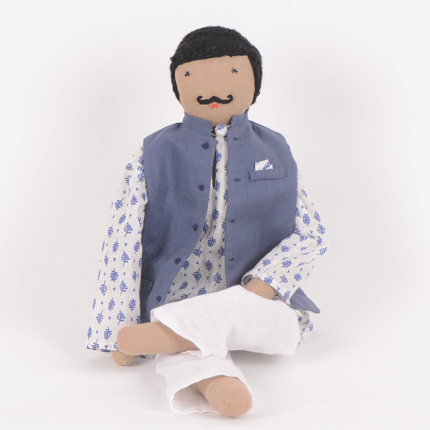 Chacha, a handcrafted cotton doll dressed in traditional Indian attire, featuring a twirled moustache and vibrant colors, symbolizing friendship and support.