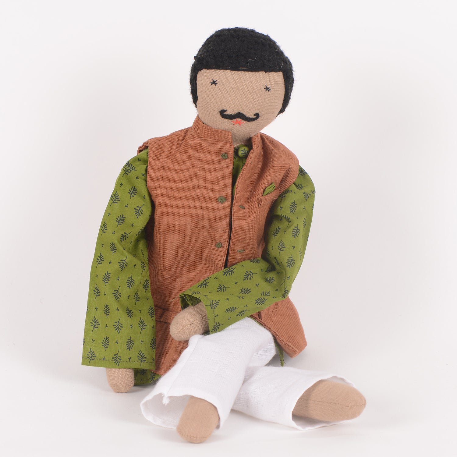 Chacha, a handcrafted cotton doll dressed in traditional Indian attire, featuring a twirled moustache and vibrant colors, symbolizing friendship and support.