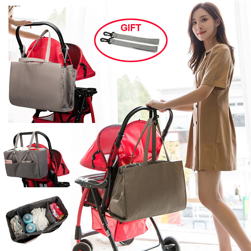 Folding Large Capacity Mother And Baby Bag in soft Oxford cloth, featuring multiple pockets and stroller attachment.