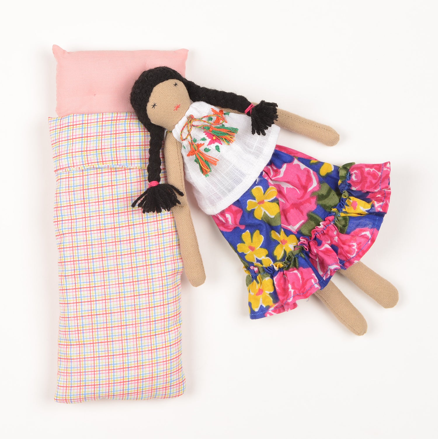 Frida Mini doll handcrafted from waste fabric, featuring bright colors and embroidered details, symbolizing love and resilience.