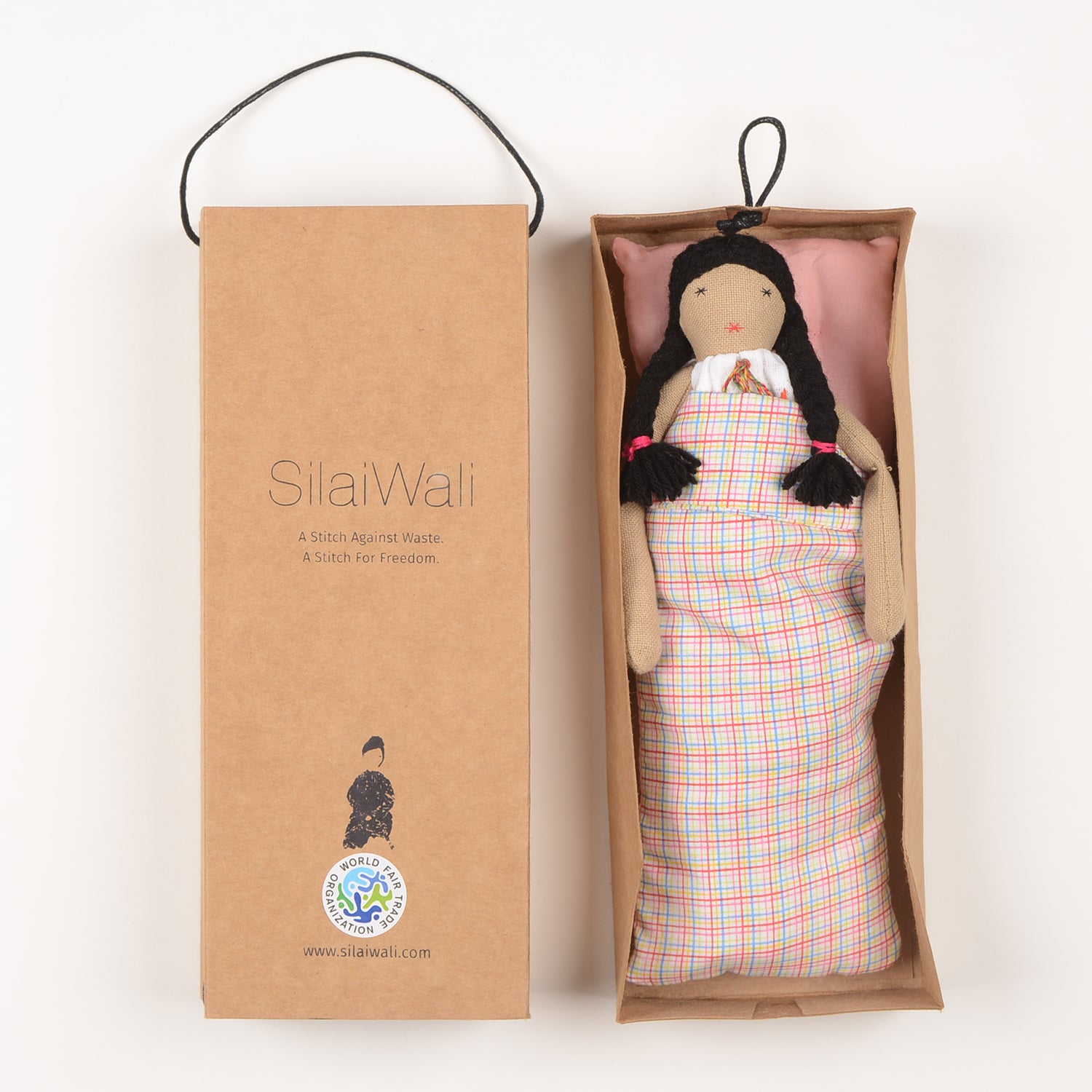 Frida Mini doll handcrafted from waste fabric, featuring bright colors and embroidered details, symbolizing love and resilience.