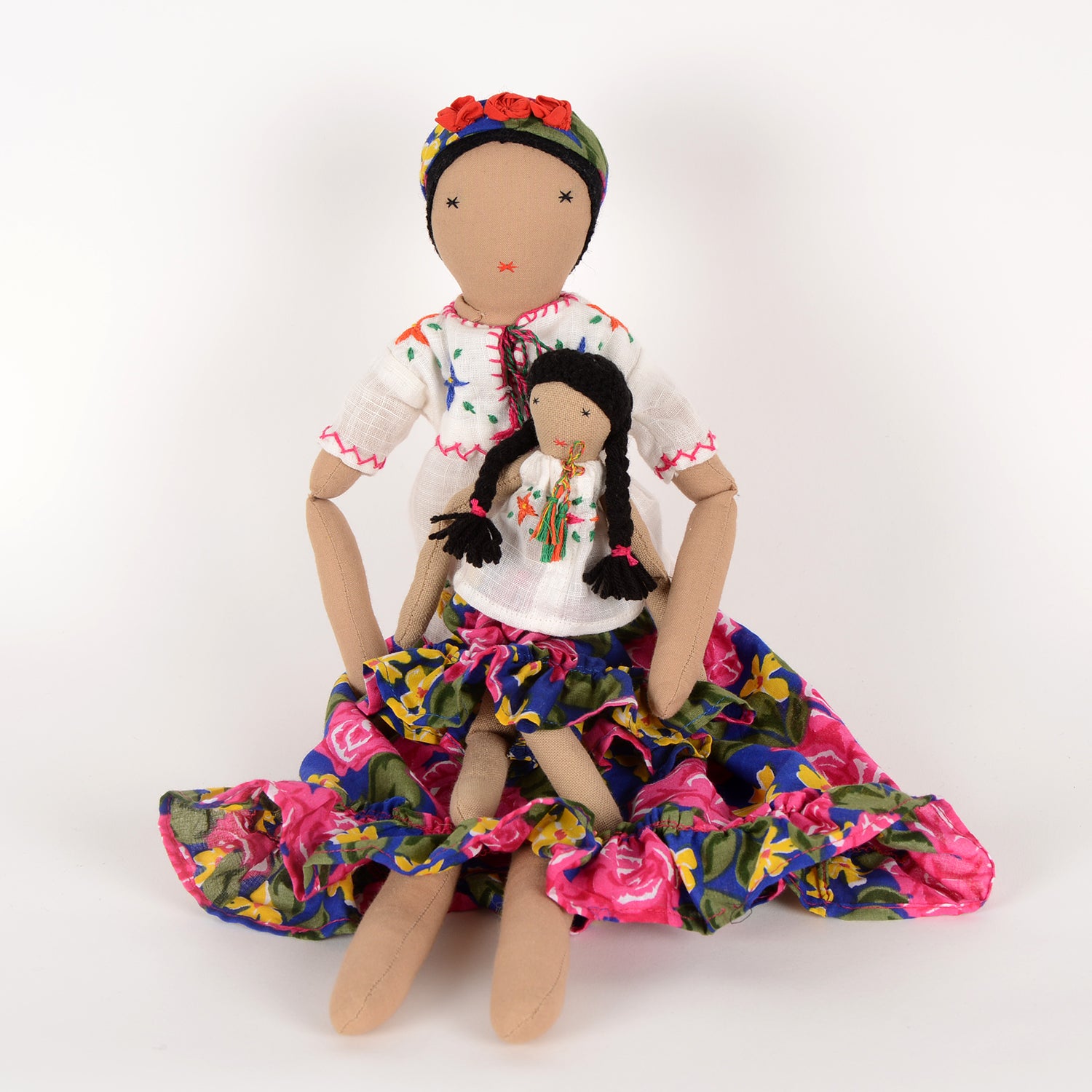 Frida Mom&Mini doll set featuring a large floral doll and a smaller version, both handcrafted by Afghan artisans with vibrant colors and intricate embroidery.