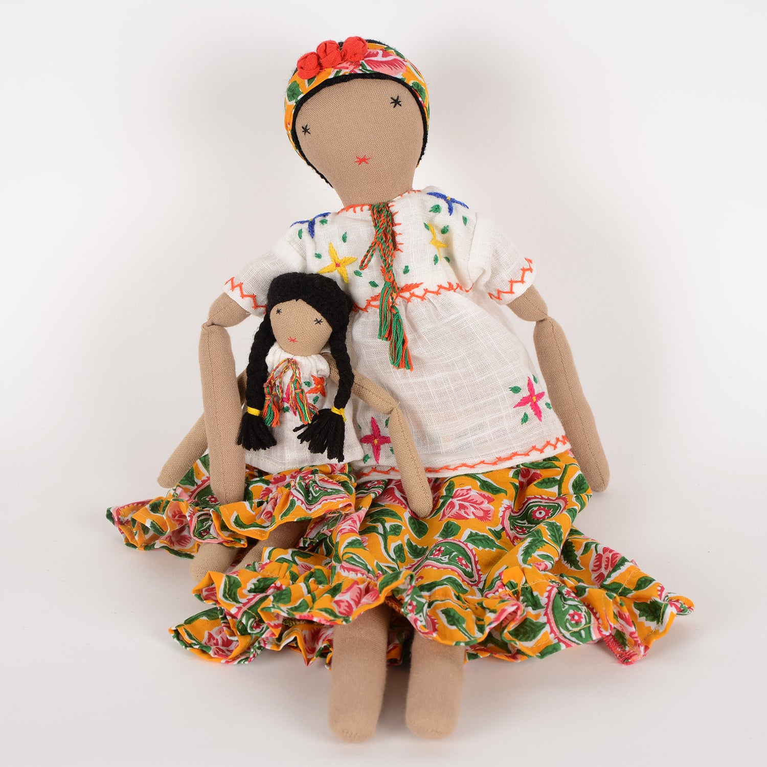 Frida Mom&Mini doll set featuring a large floral doll and a smaller version, both handcrafted by Afghan artisans with vibrant colors and intricate embroidery.