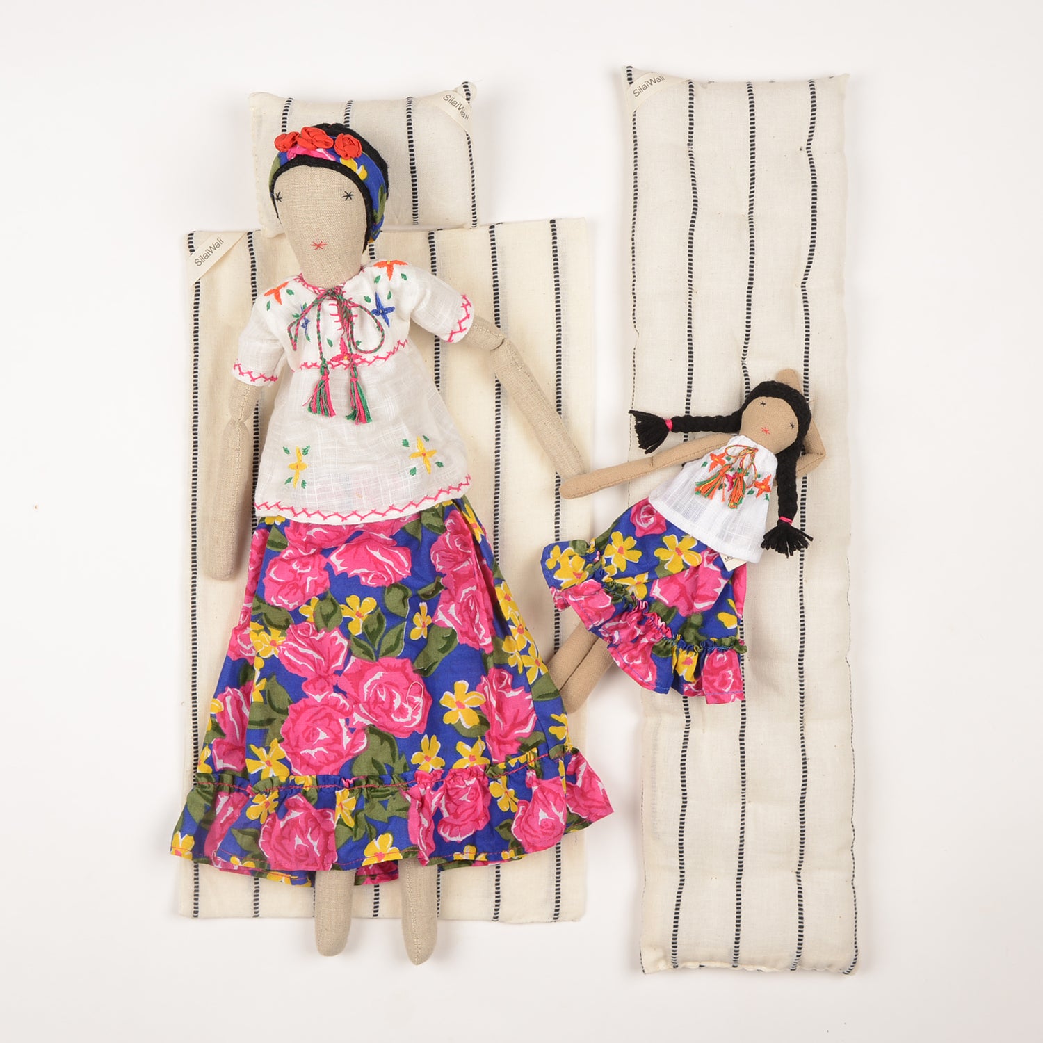 Frida Mom&Mini doll set featuring a large floral doll and a smaller version, both handcrafted by Afghan artisans with vibrant colors and intricate embroidery.