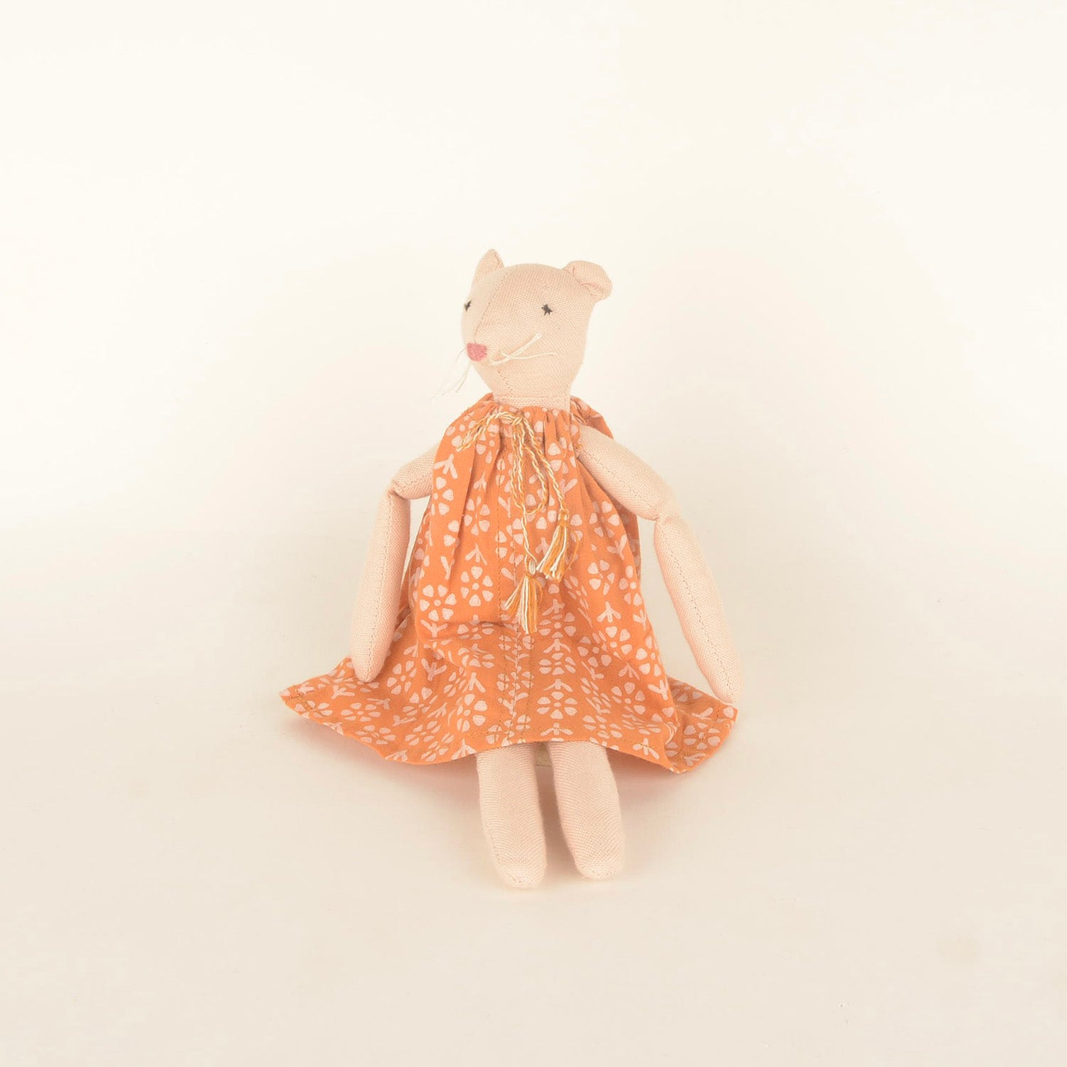 Isla Mini, a handcrafted mouse doll made from sustainable materials, featuring cotton body, woollen hair, and bedding in a foldable box.