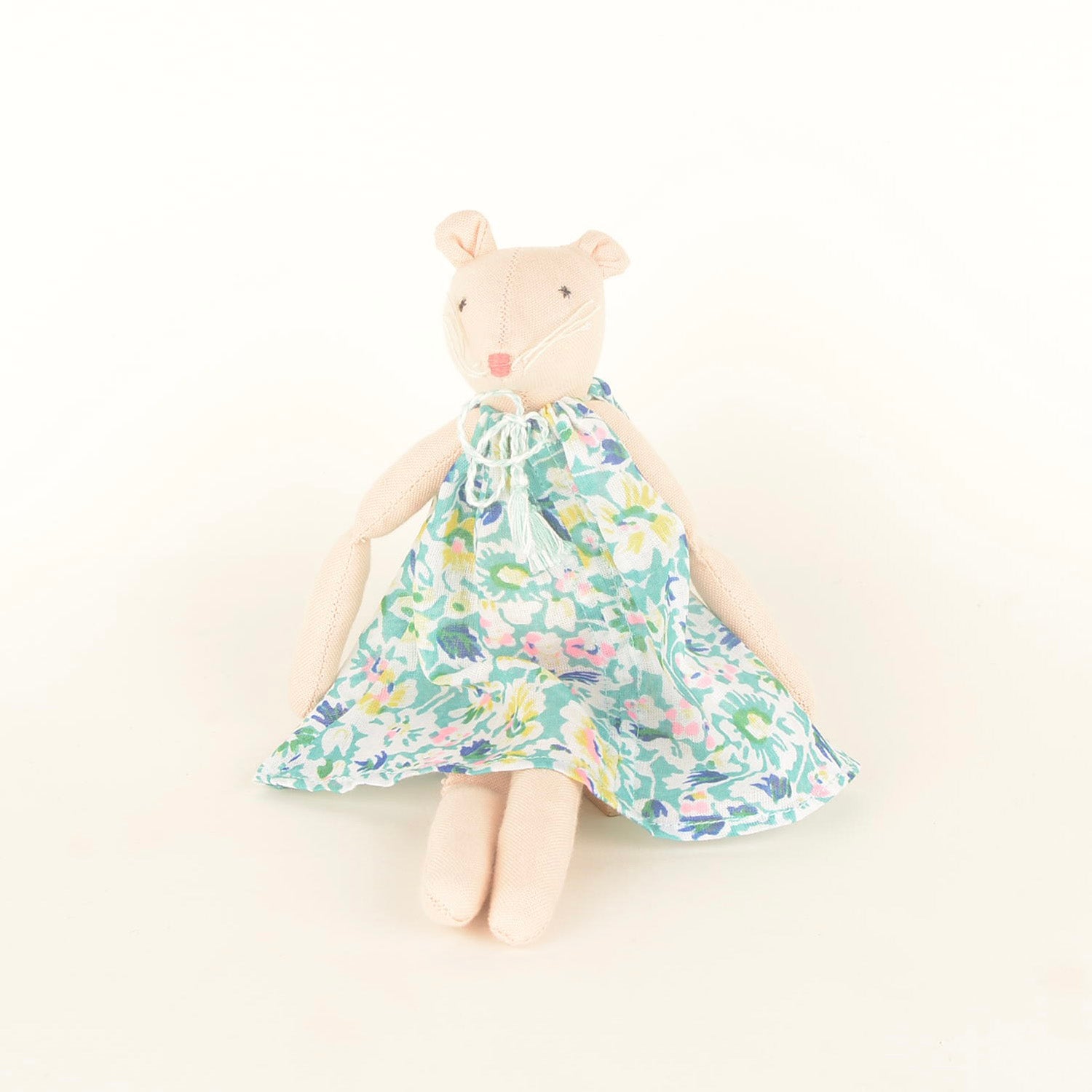 Isla Mini, a handcrafted mouse doll made from sustainable materials, featuring cotton body, woollen hair, and bedding in a foldable box.