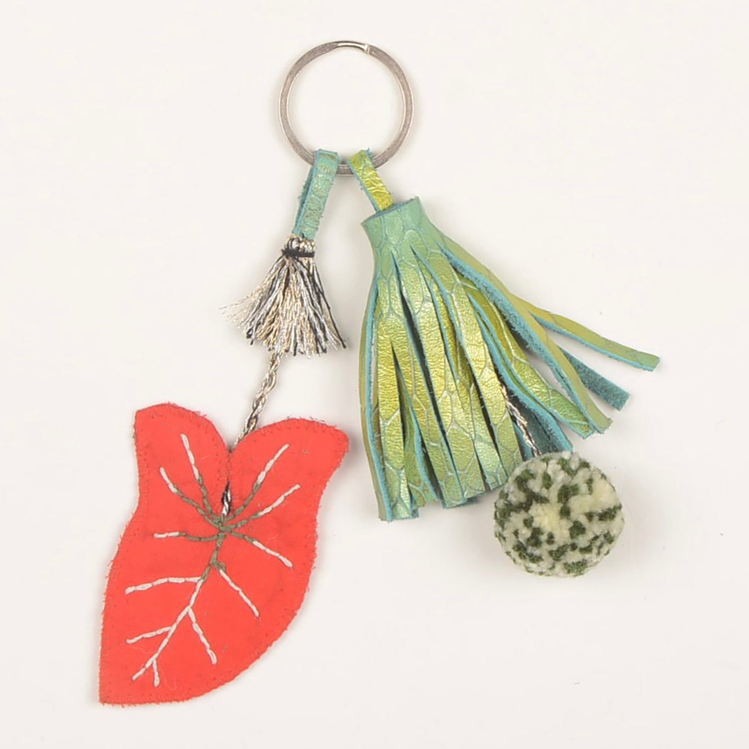 KC_RED_LEAF_01 key chain handcrafted from waste fabric, featuring a unique design by Hazara artisans with a lead-free nickel-coated metal ring.