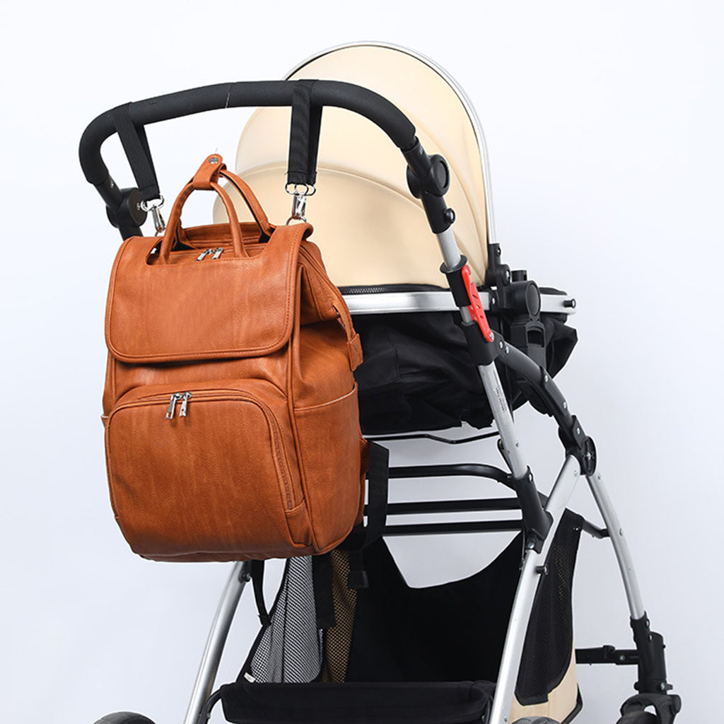 Stylish New PU Leather Diaper Bag in black, featuring multiple pockets and stroller straps, ideal for modern moms.