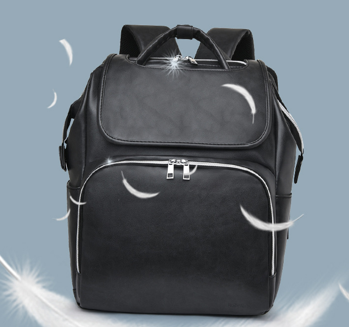 Stylish New PU Leather Diaper Bag in black, featuring multiple pockets and stroller straps, ideal for modern moms.